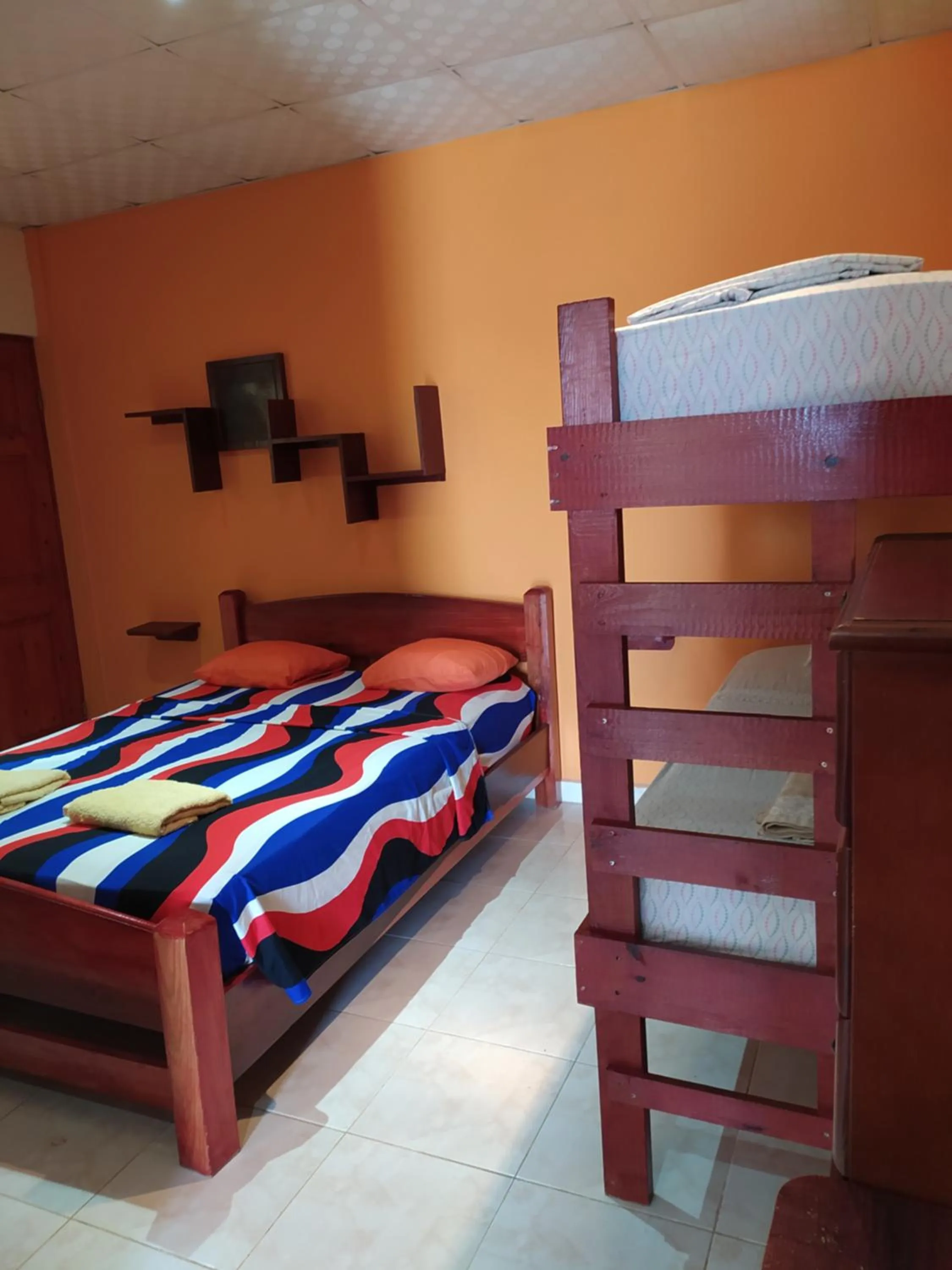 Bed in Sun Havens Apartments & Suites