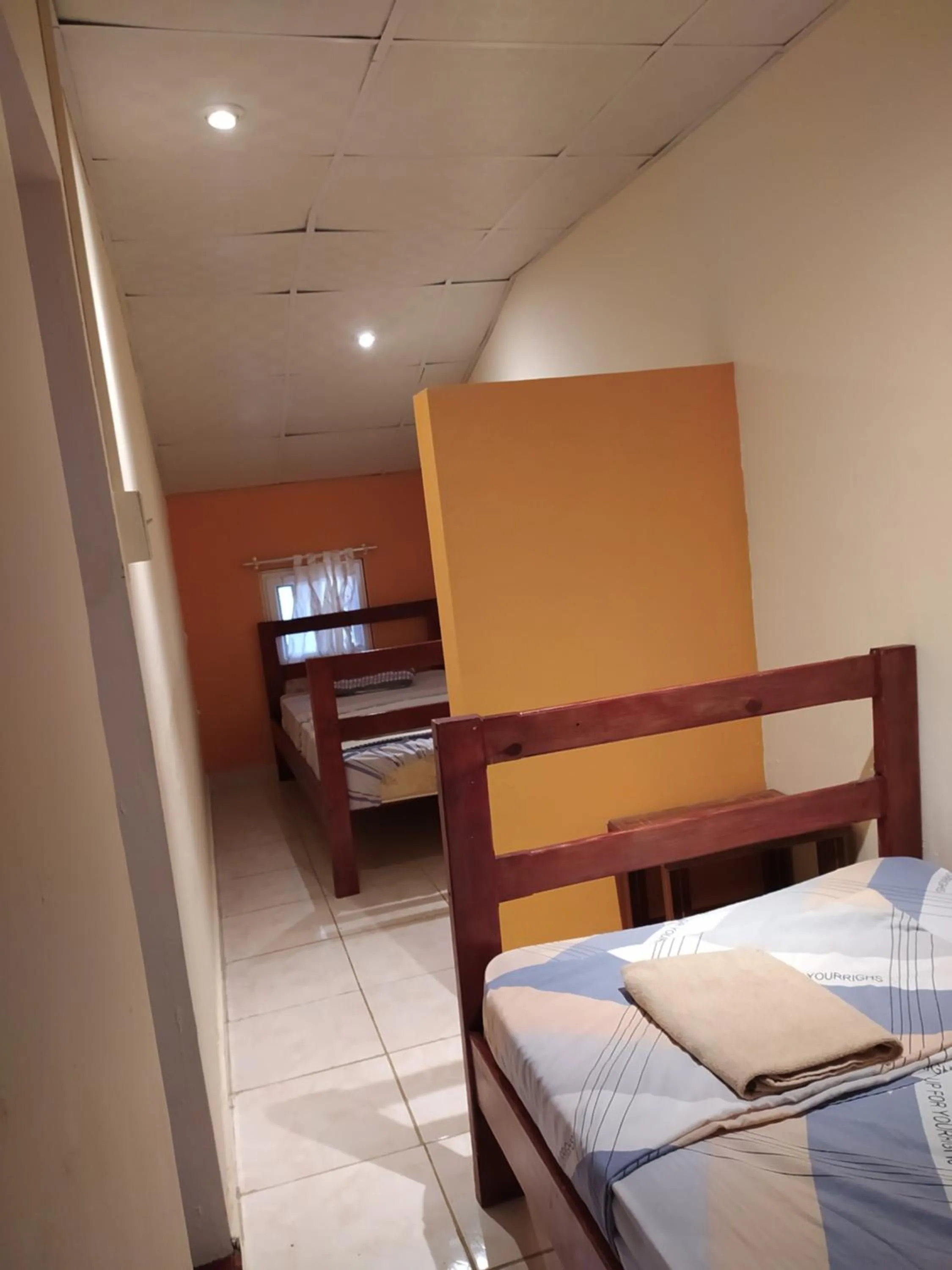 Bed in Sun Havens Apartments & Suites