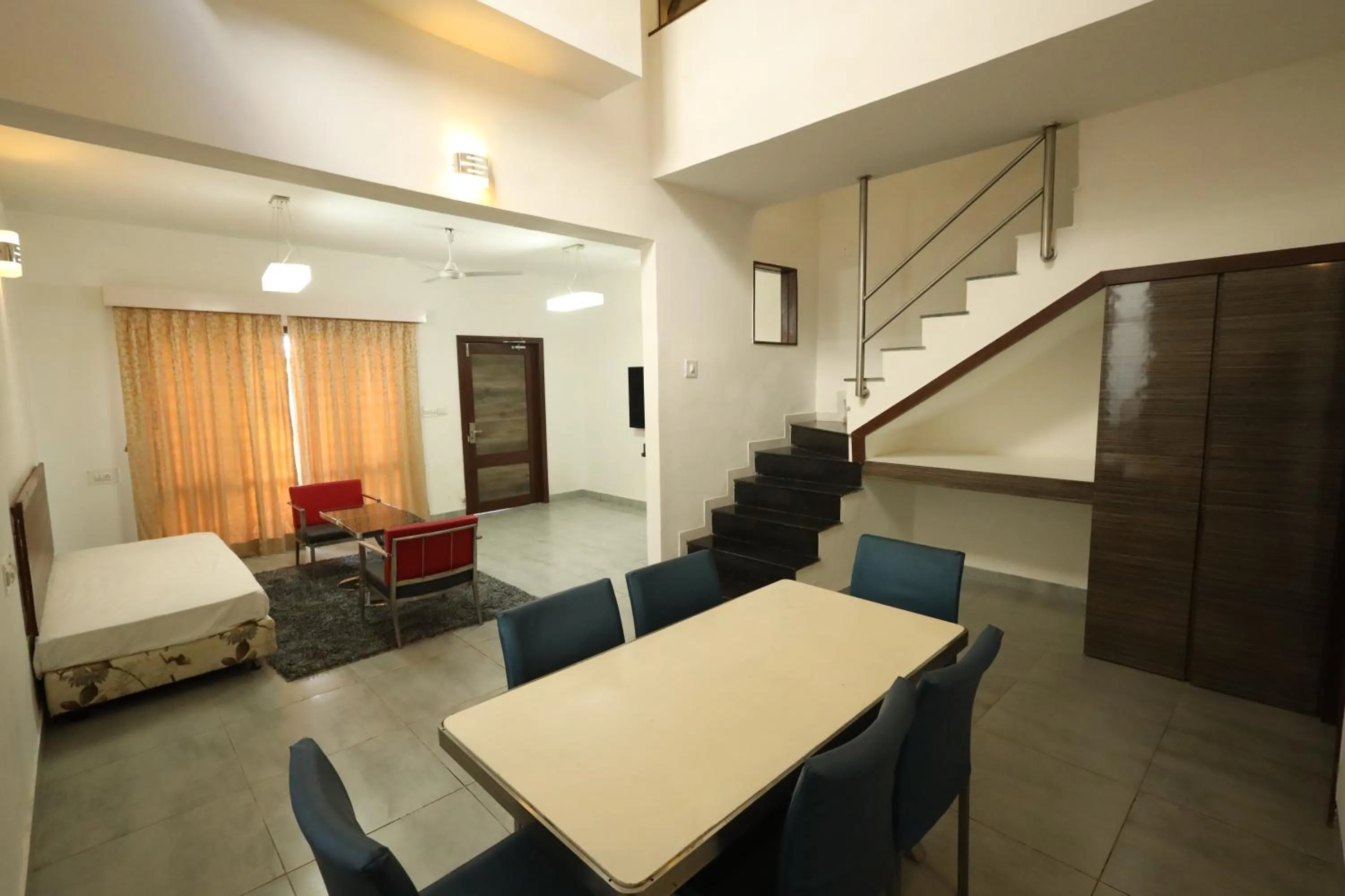 Seating area, Bed in Hummingbird Resort