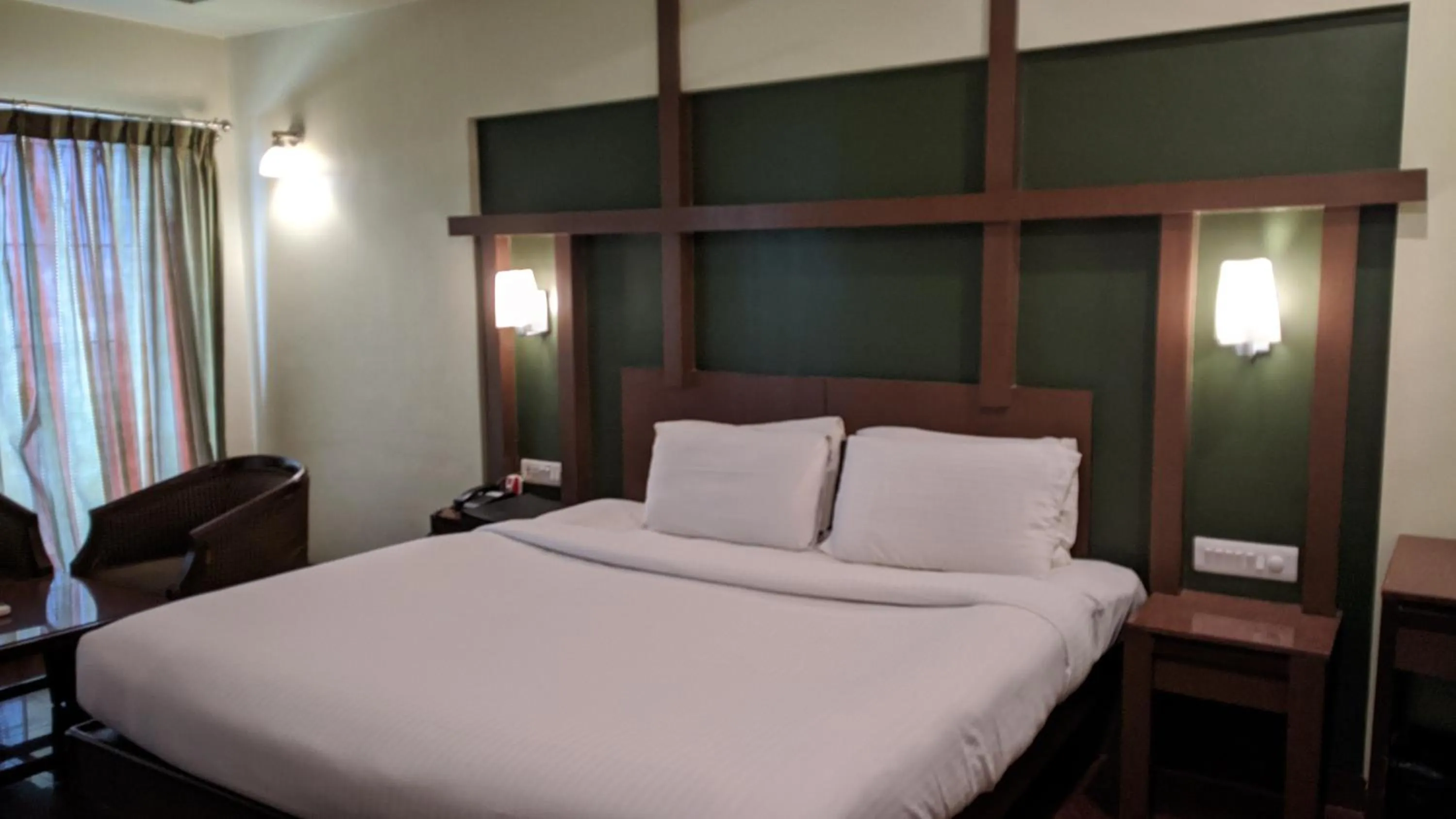 Bed in Hotel Sankam Residency