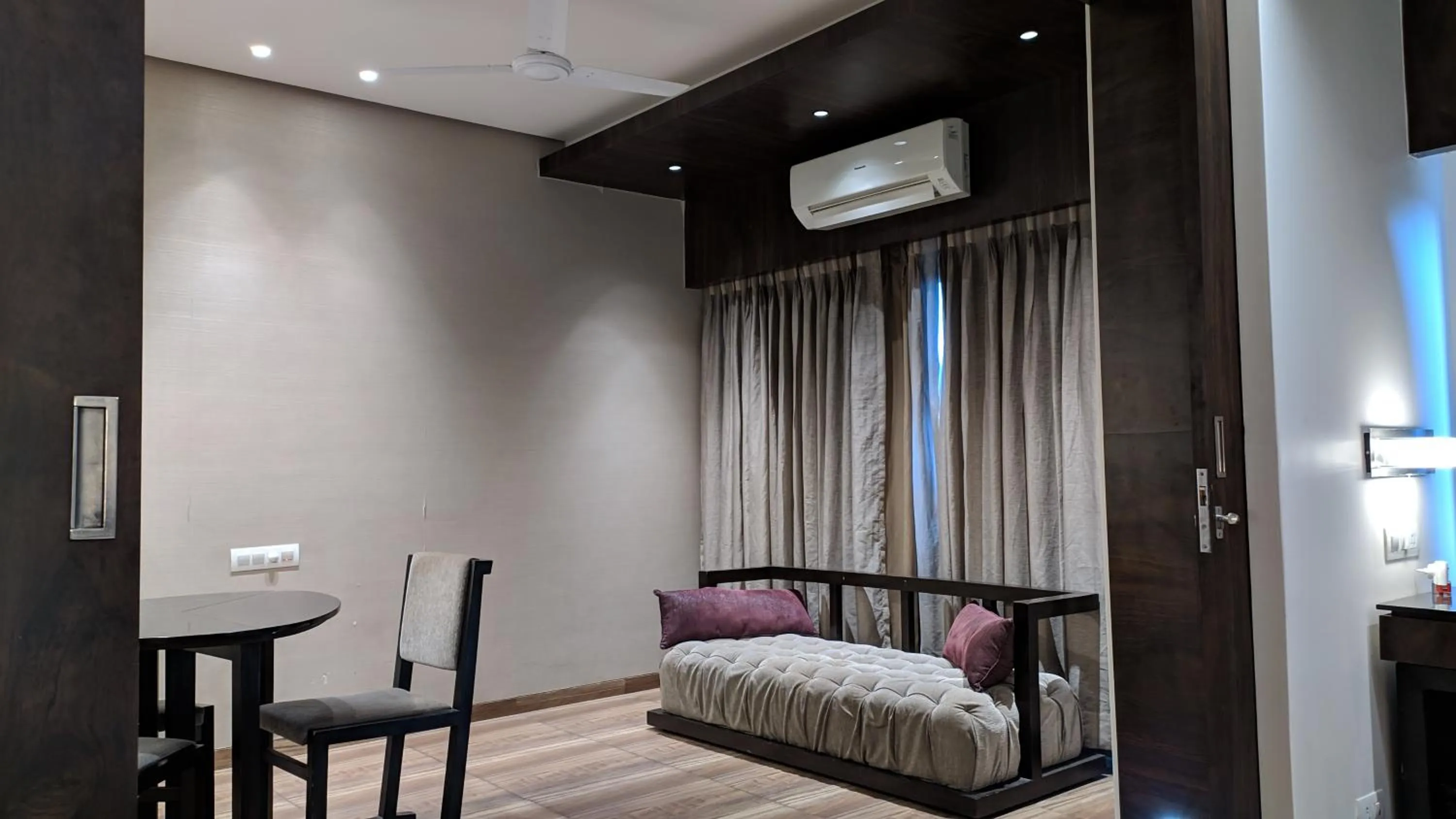 Seating area, Bed in Hotel Sankam Residency