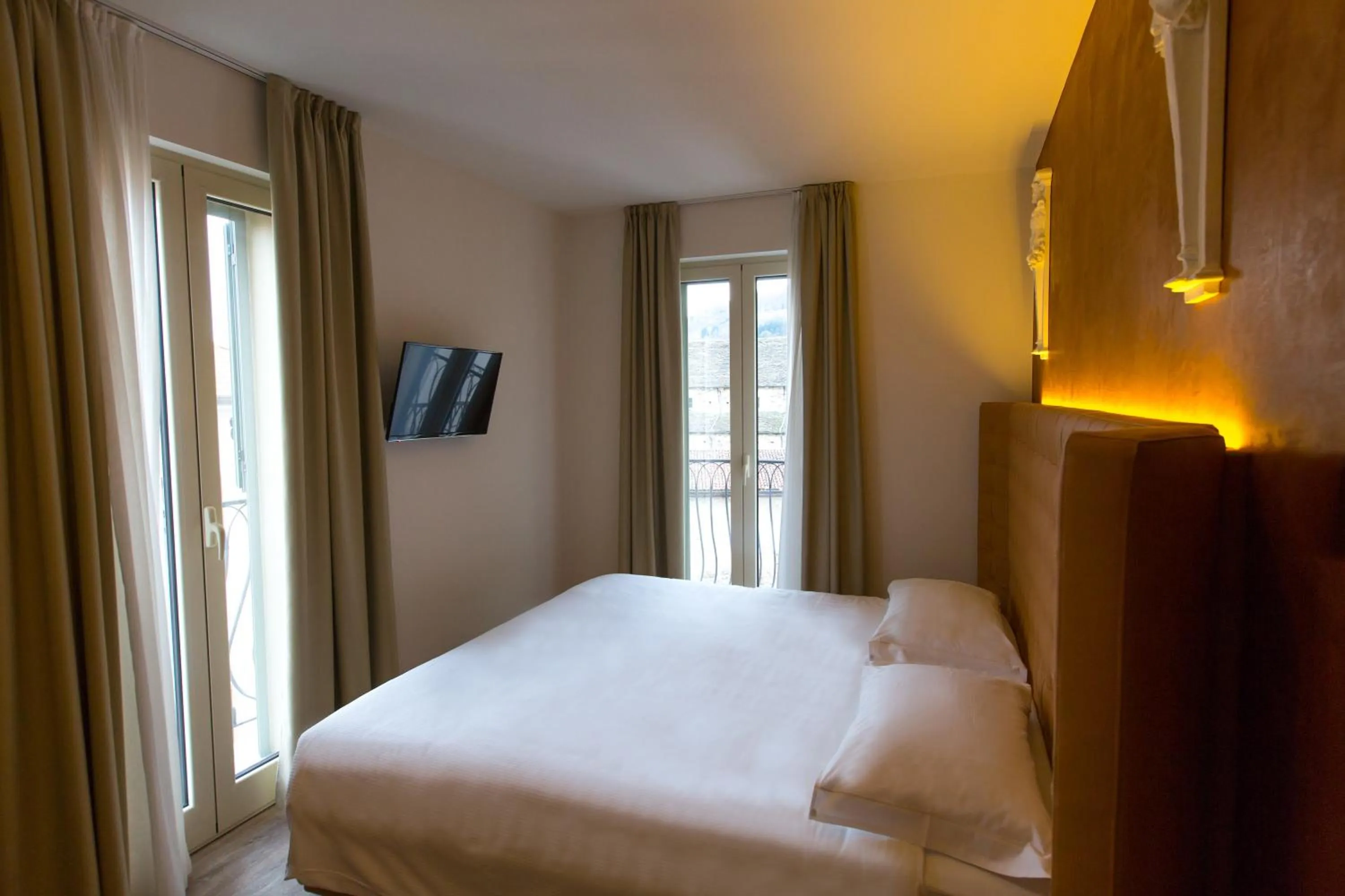 Bedroom, Bed in Hotel Al Campanile - Luxury Suites & Apartments