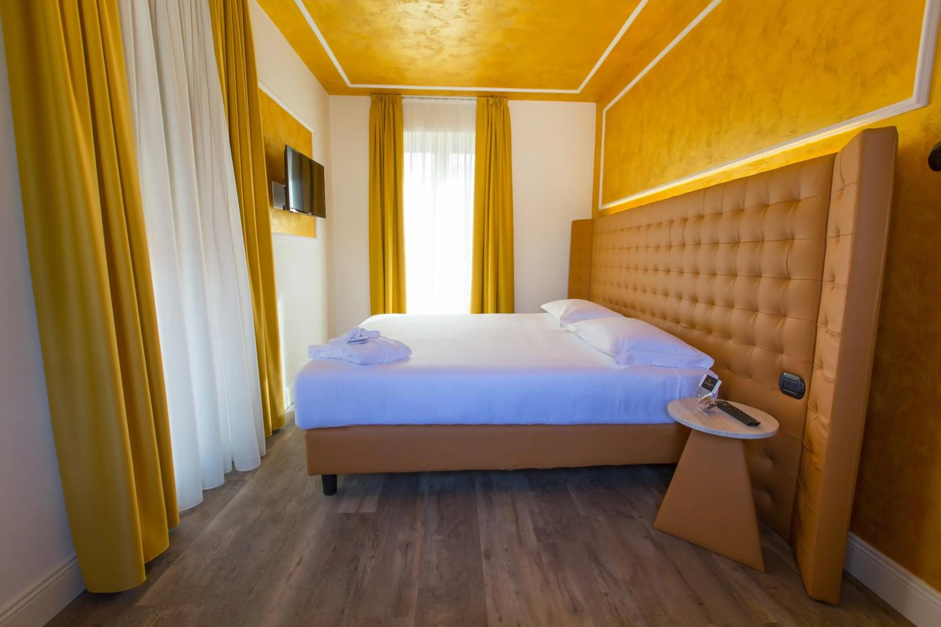 Photo of the whole room, Bed in Hotel Al Campanile - Luxury Suites & Apartments