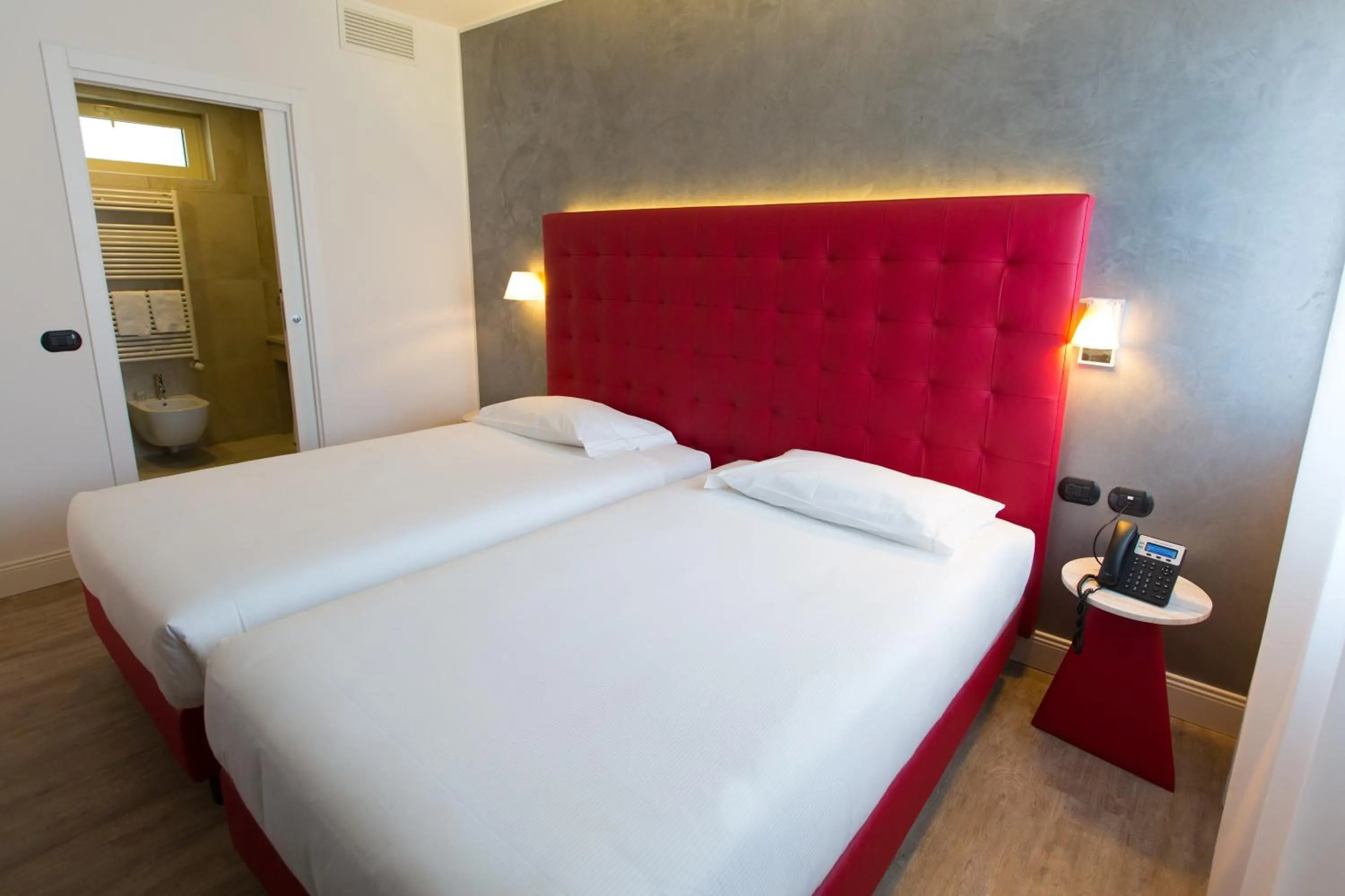 Bed in Hotel Al Campanile - Luxury Suites & Apartments