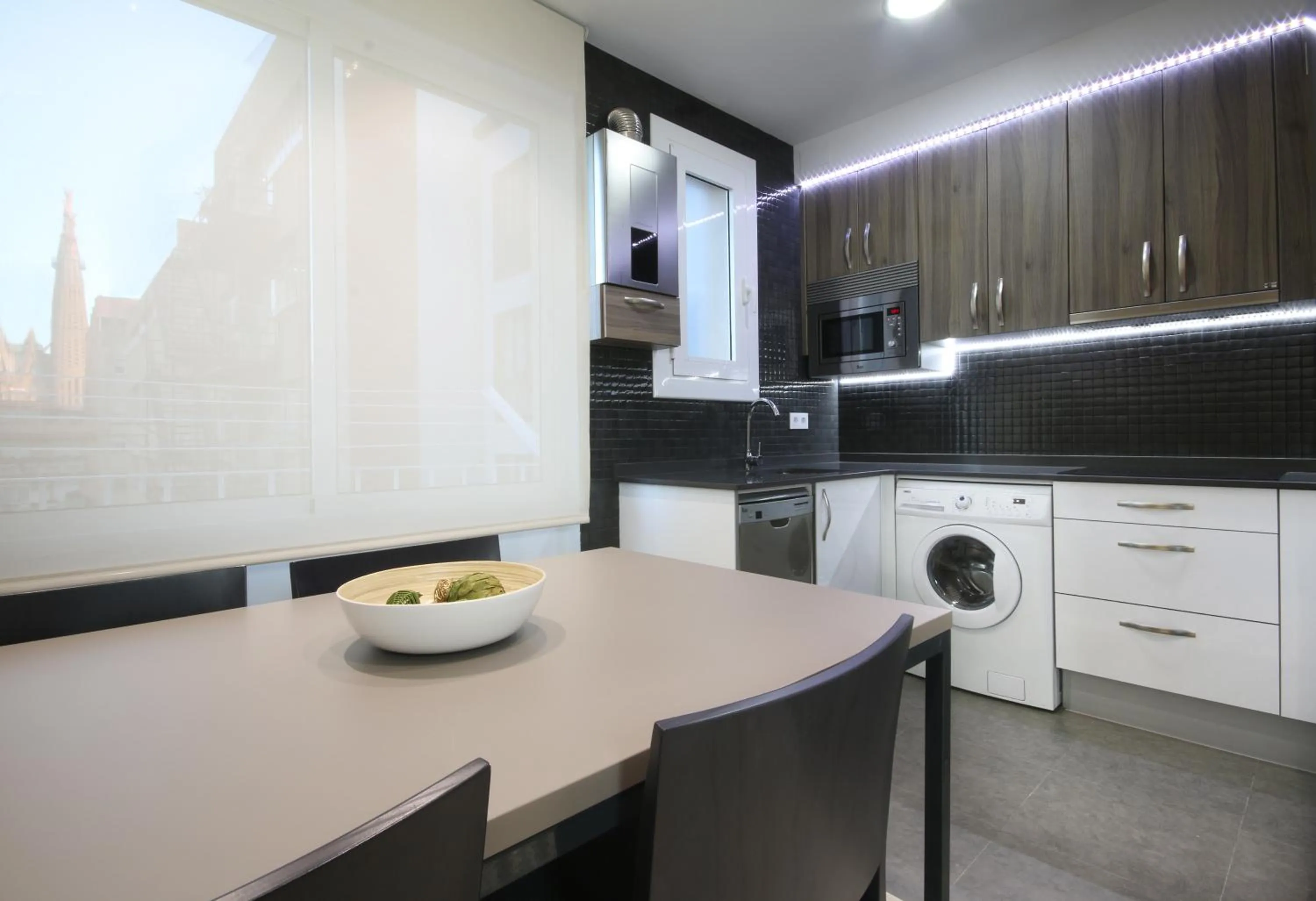 Kitchen or kitchenette in Suite Place Barcelona Còrsega