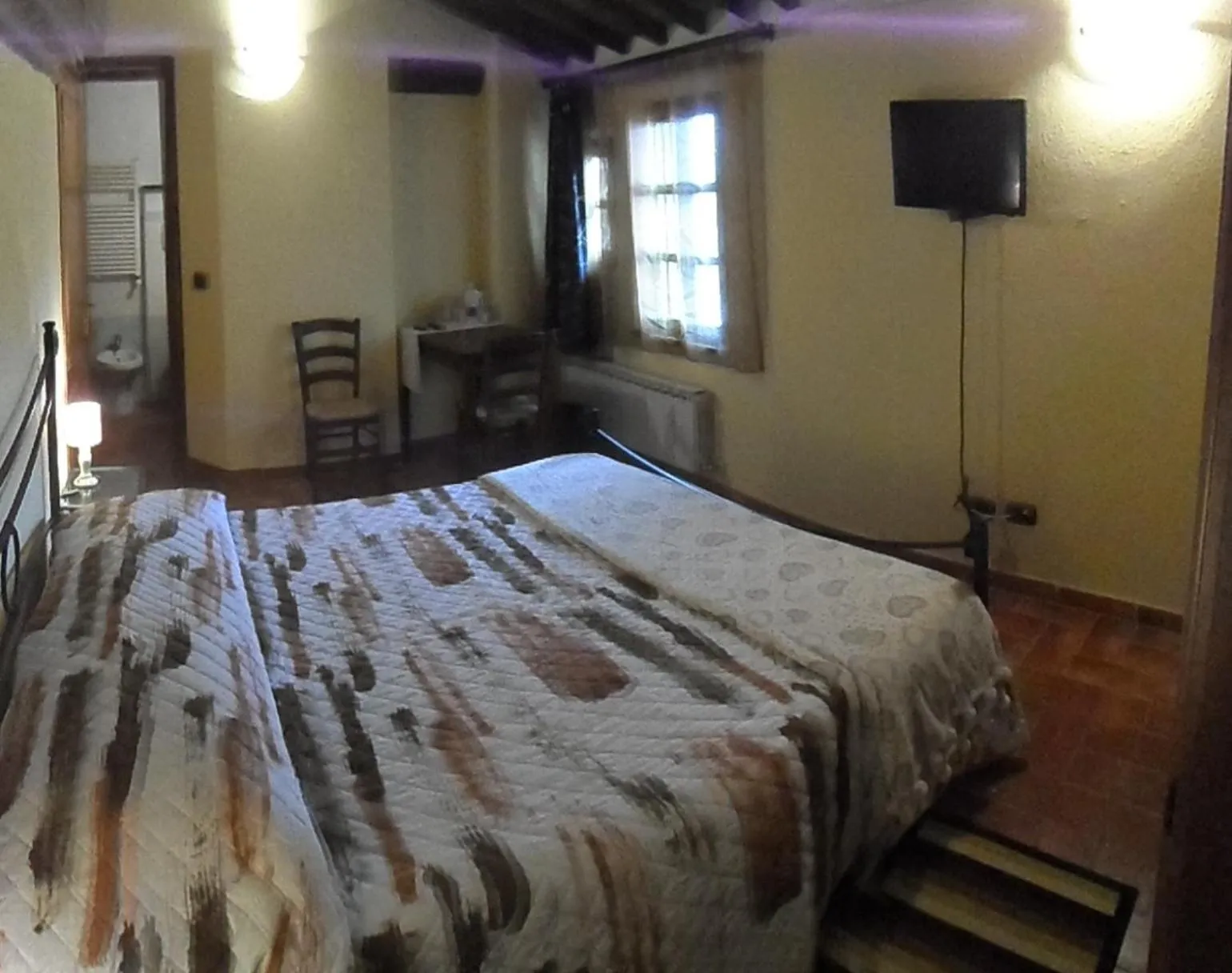 Photo of the whole room, Bed in Il Pozzo Di Sant'Andrea