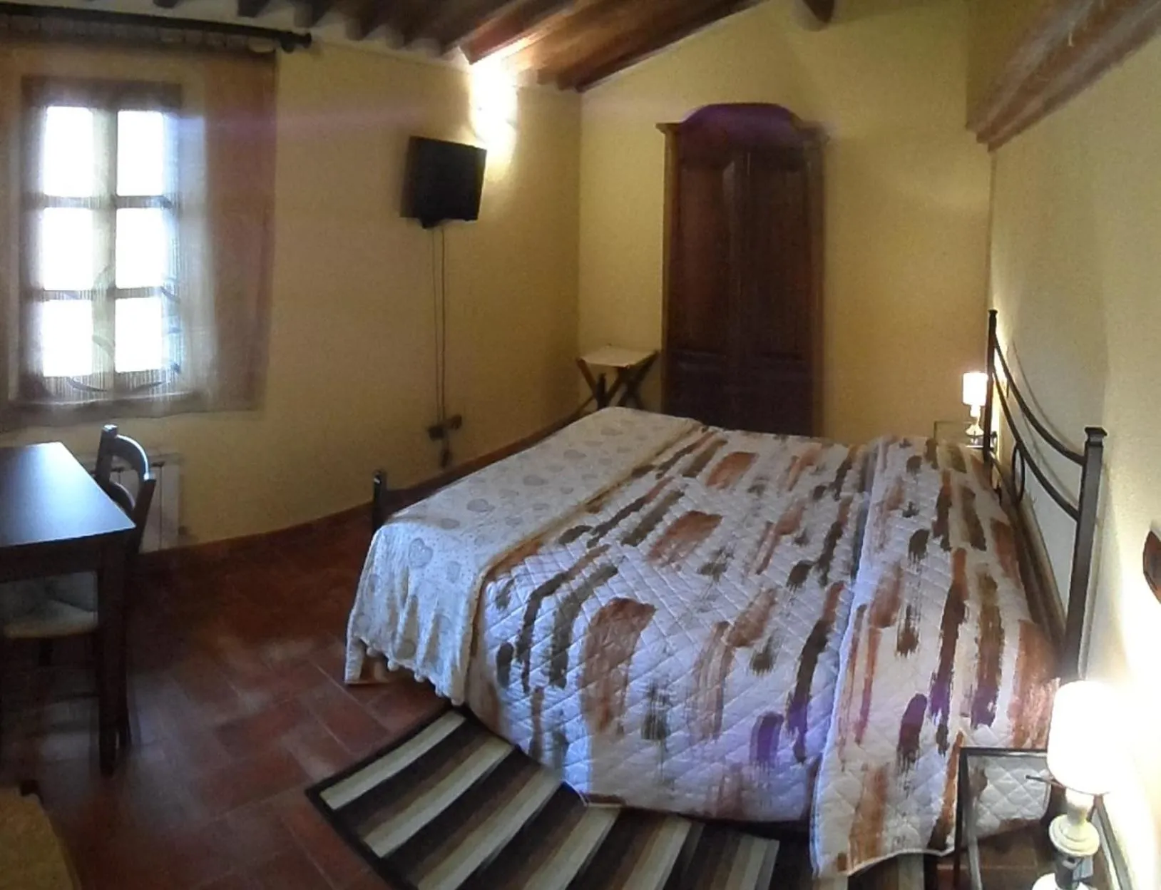 Photo of the whole room, Bed in Il Pozzo Di Sant'Andrea