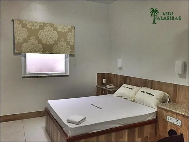 Bed in Hotel Palmeiras Ltda
