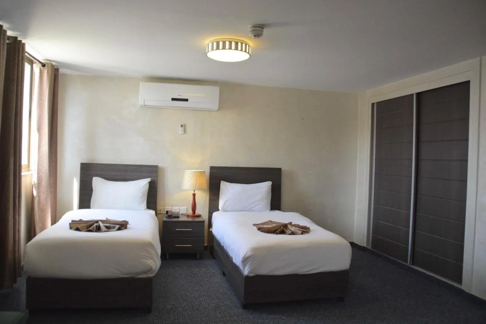 Bed in Olive Hotel Amman