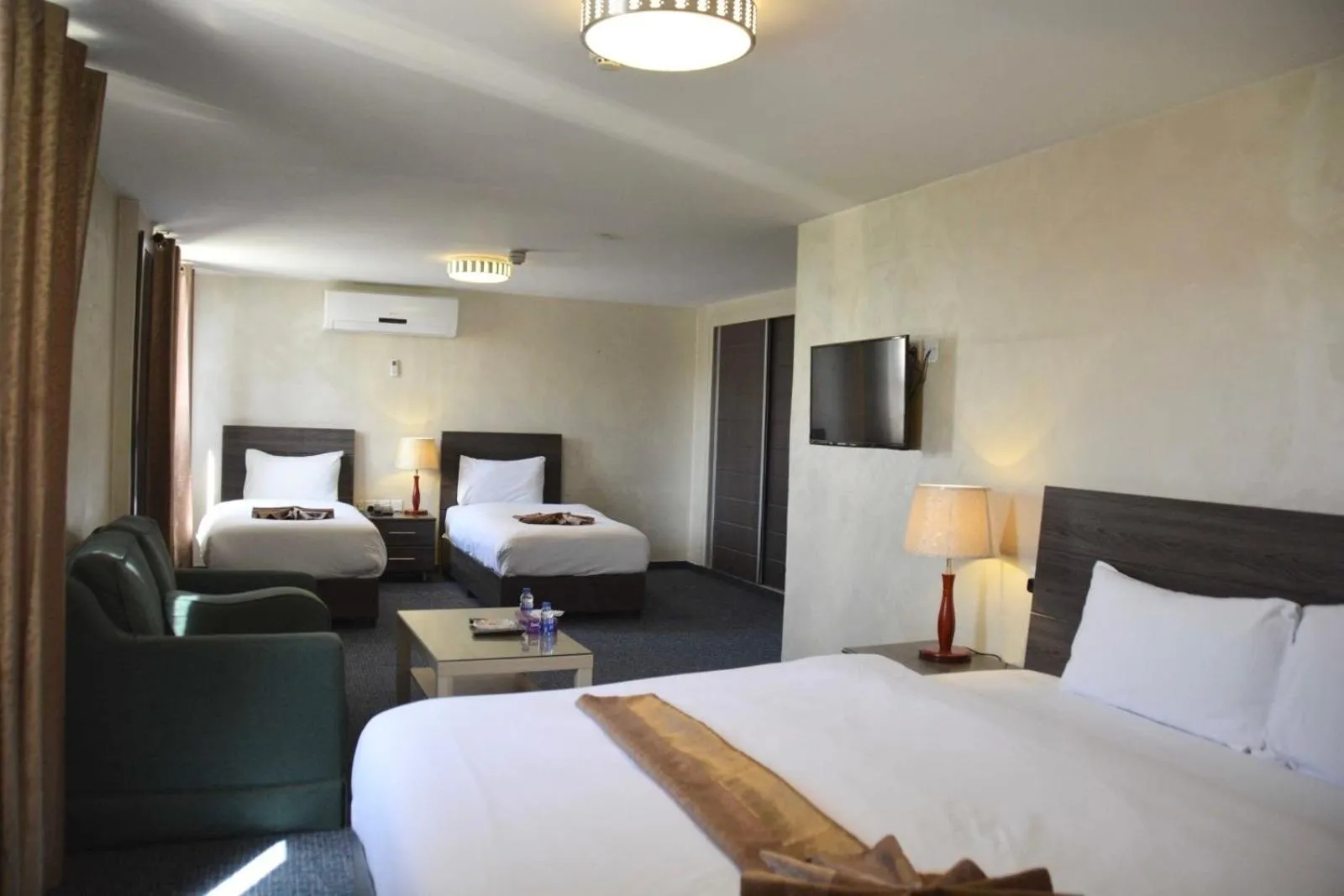 Bed in Olive Hotel Amman