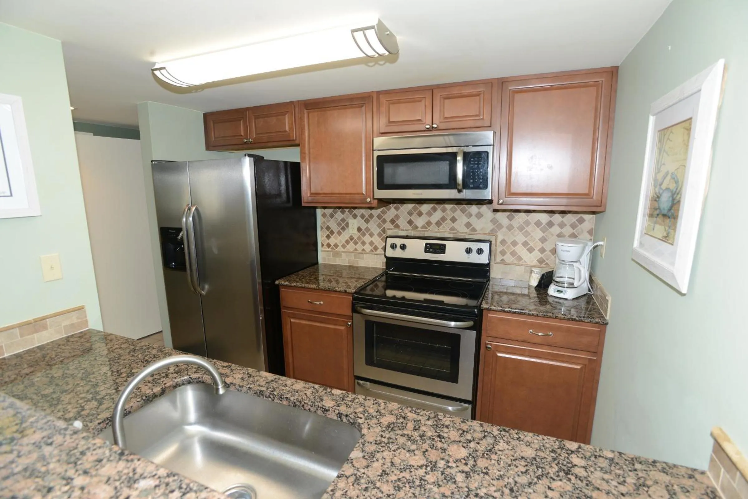 Kitchen or kitchenette in Sand Dunes Tower Suites and Villas