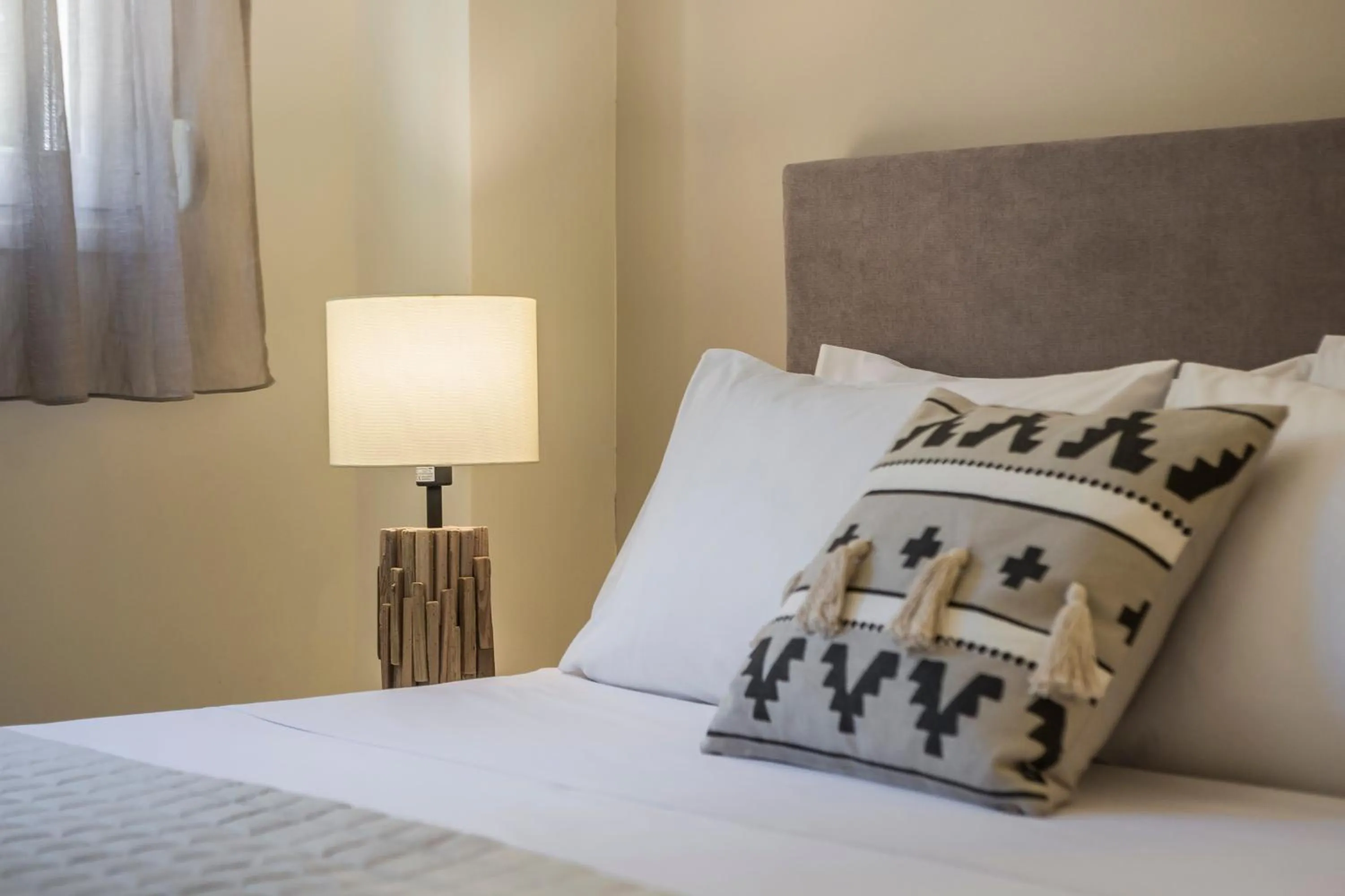 Bed in Meliti Waterfront Suites