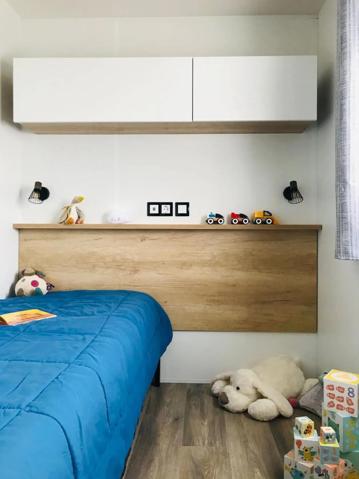 Bed in Camping Les P'tites Maisons dans la Prairie