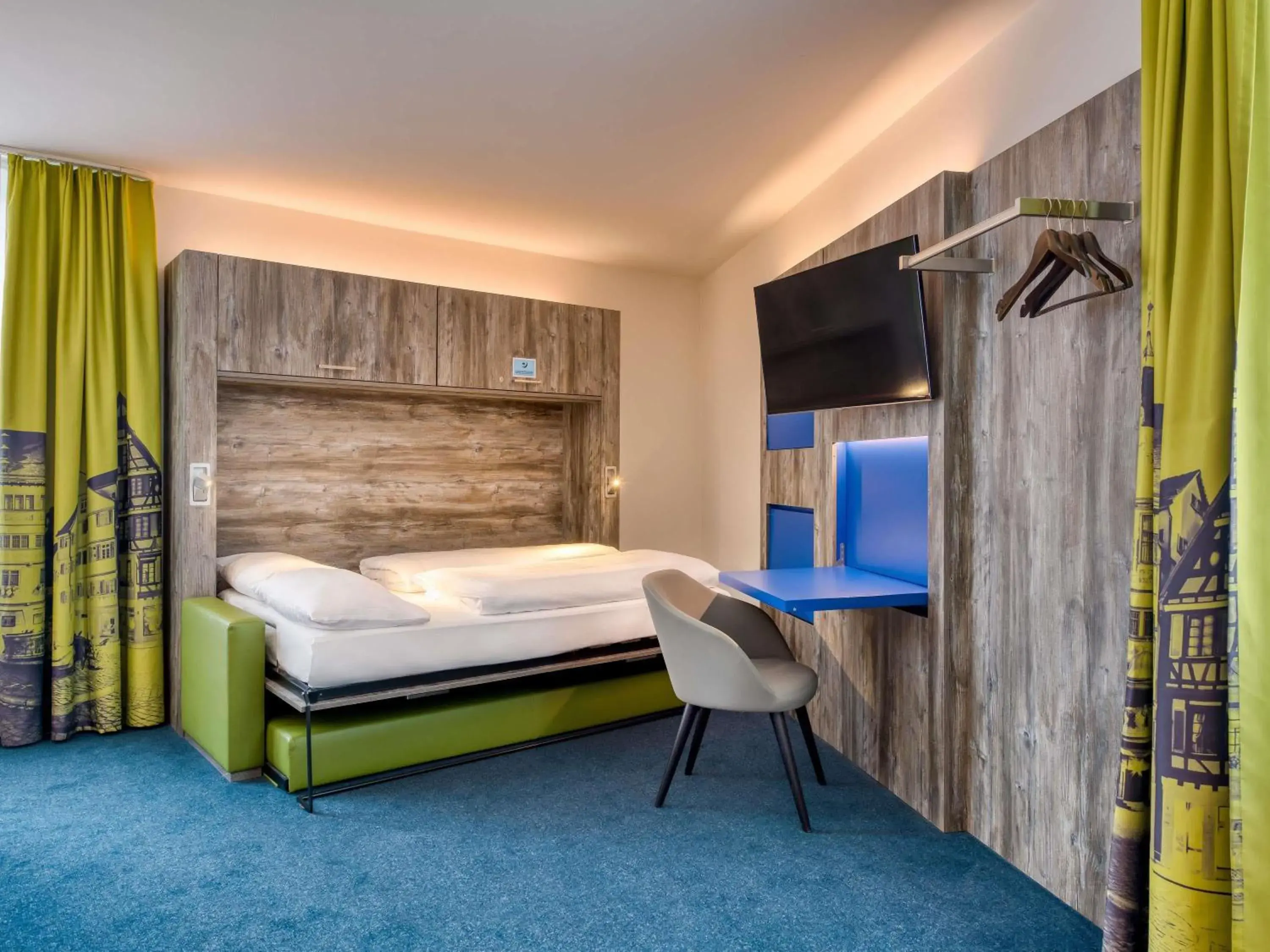 Standard Suite with One Double Bed and Two Single Beds in ibis Styles Tuebingen Standard Suite with One Double Bed and Two Single Beds in ibis Styles Tuebingen
