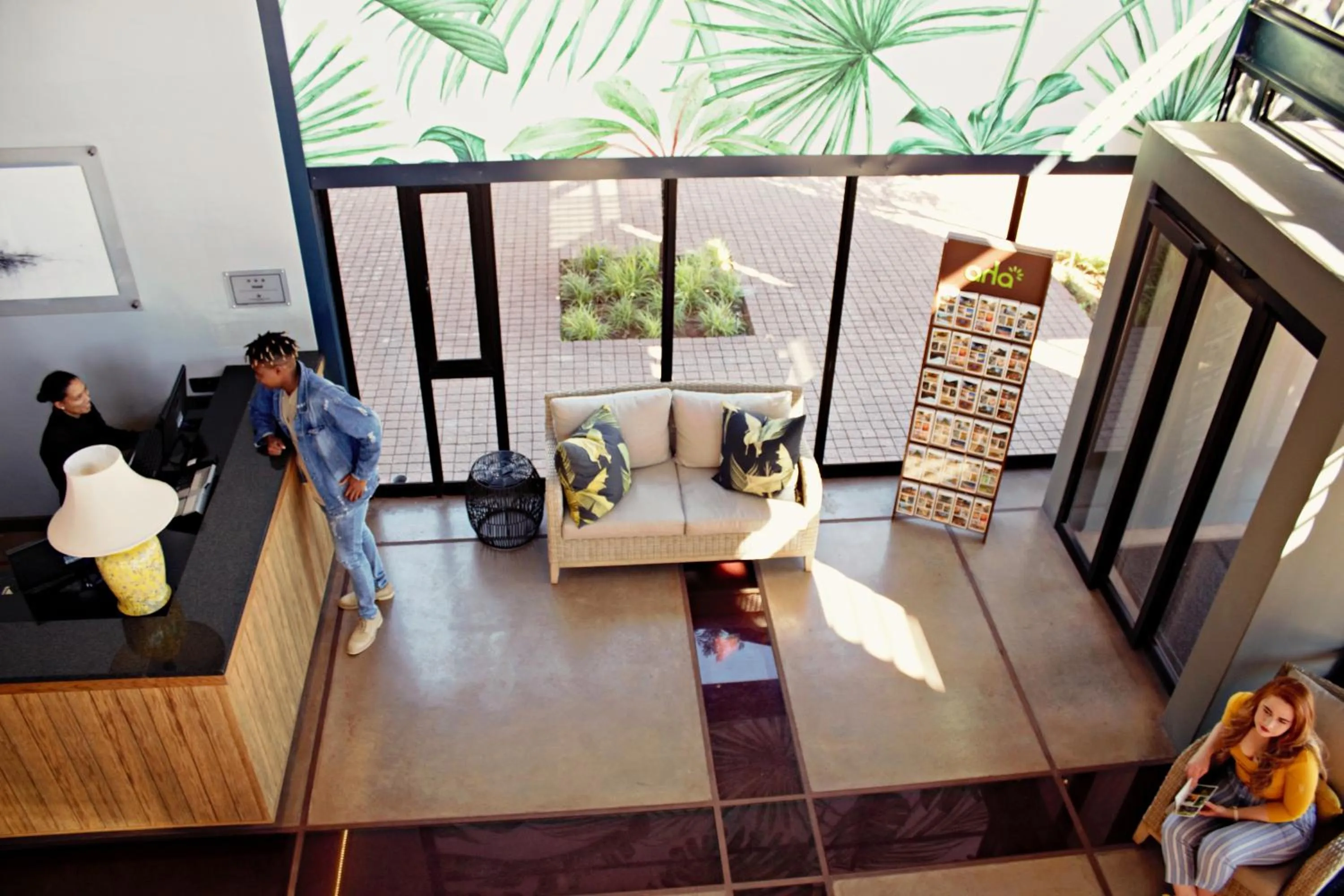 Communal lounge/ TV room in aha Kathu Hotel