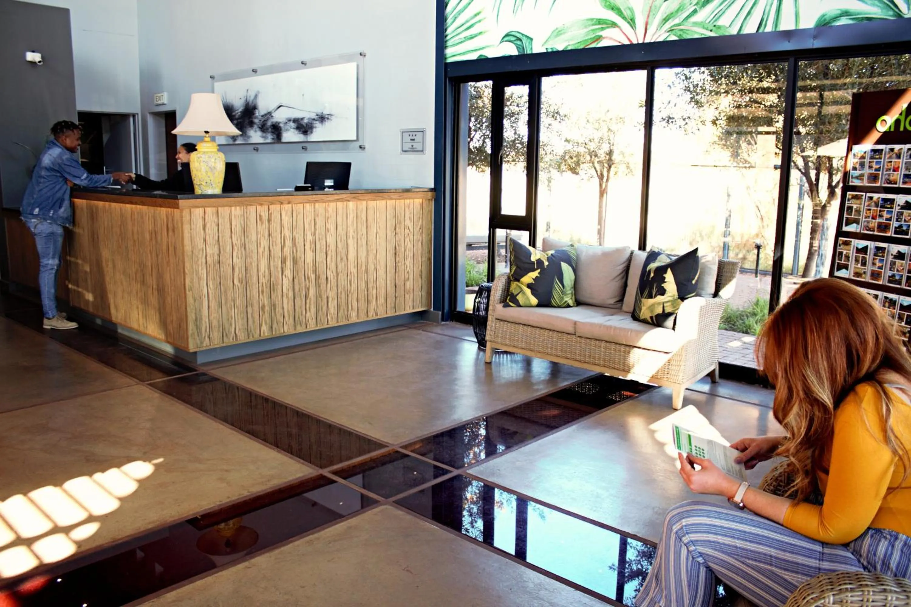 Communal lounge/ TV room in aha Kathu Hotel