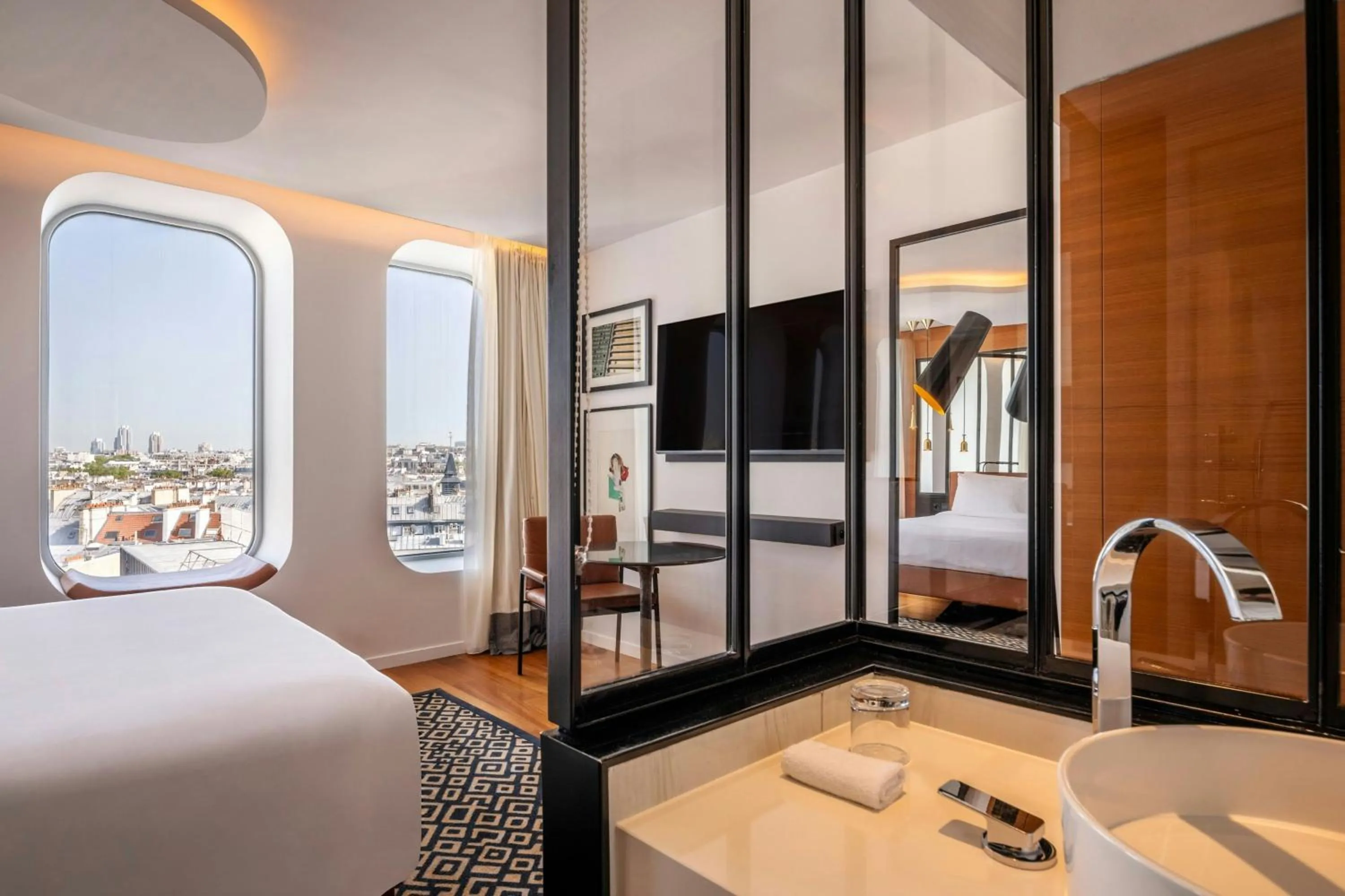 Bathroom, Bed in Renaissance Paris Republique Hotel & Spa