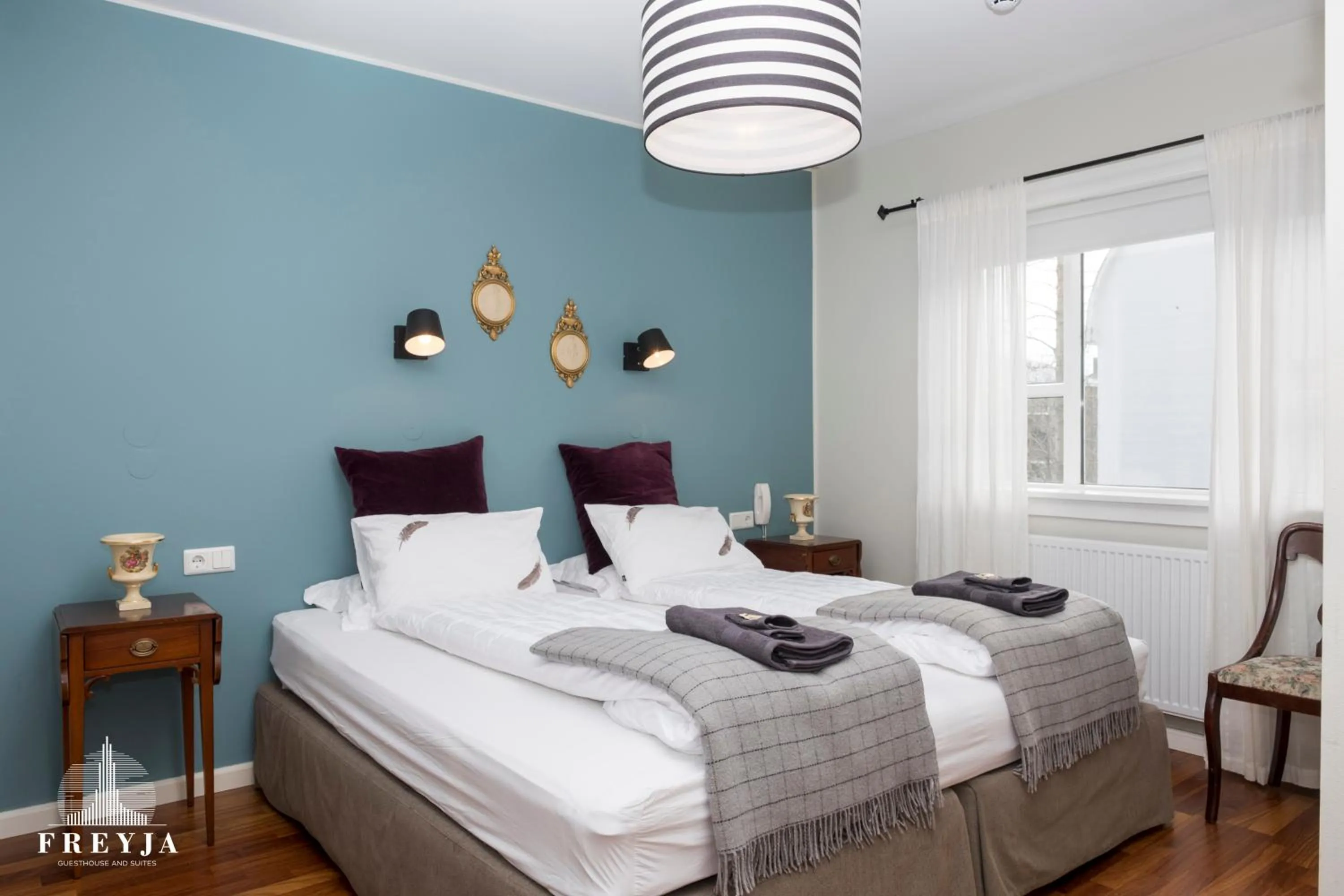 Bed in Freyja Guesthouse & Suites