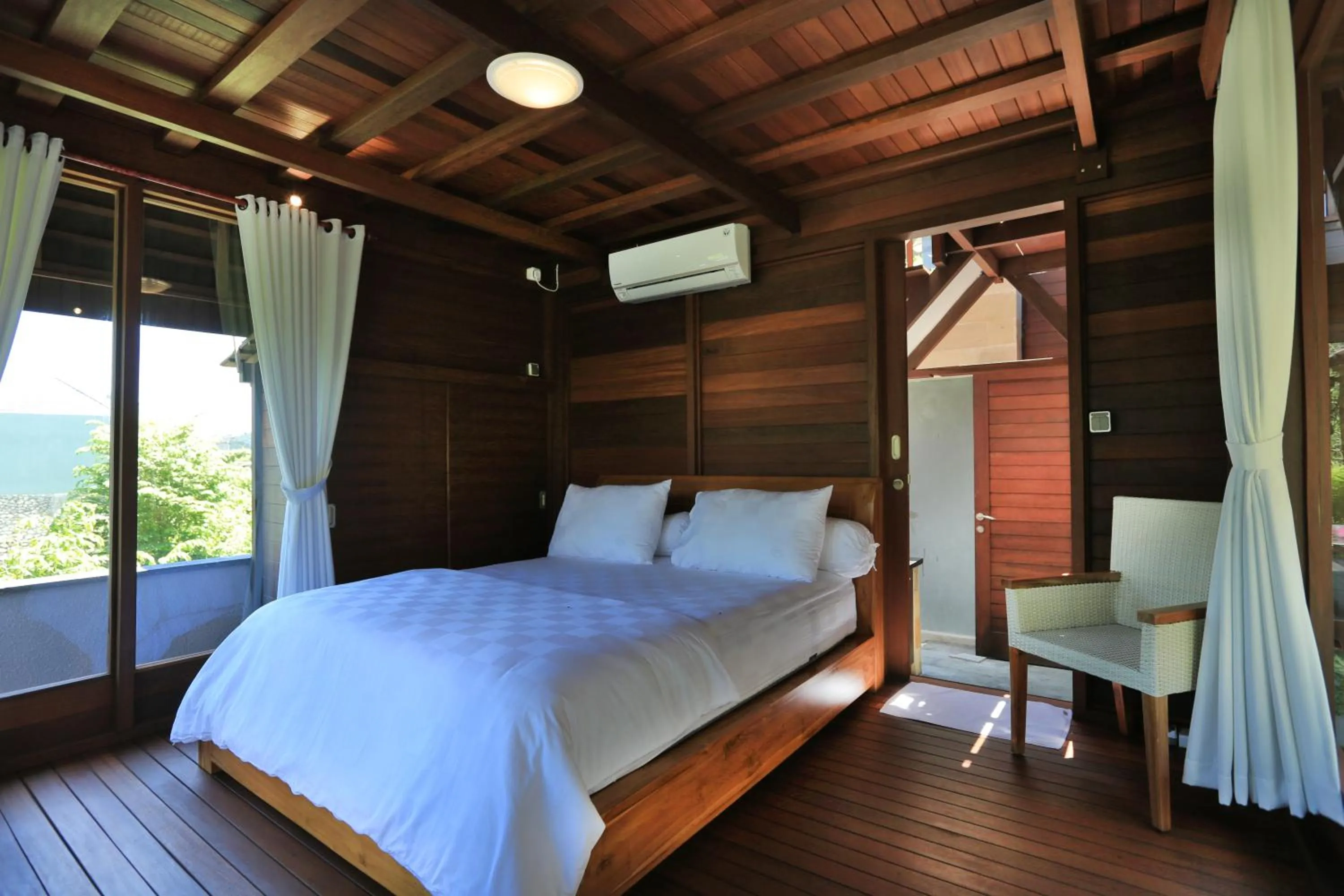 Bed in Raja Woods Villa