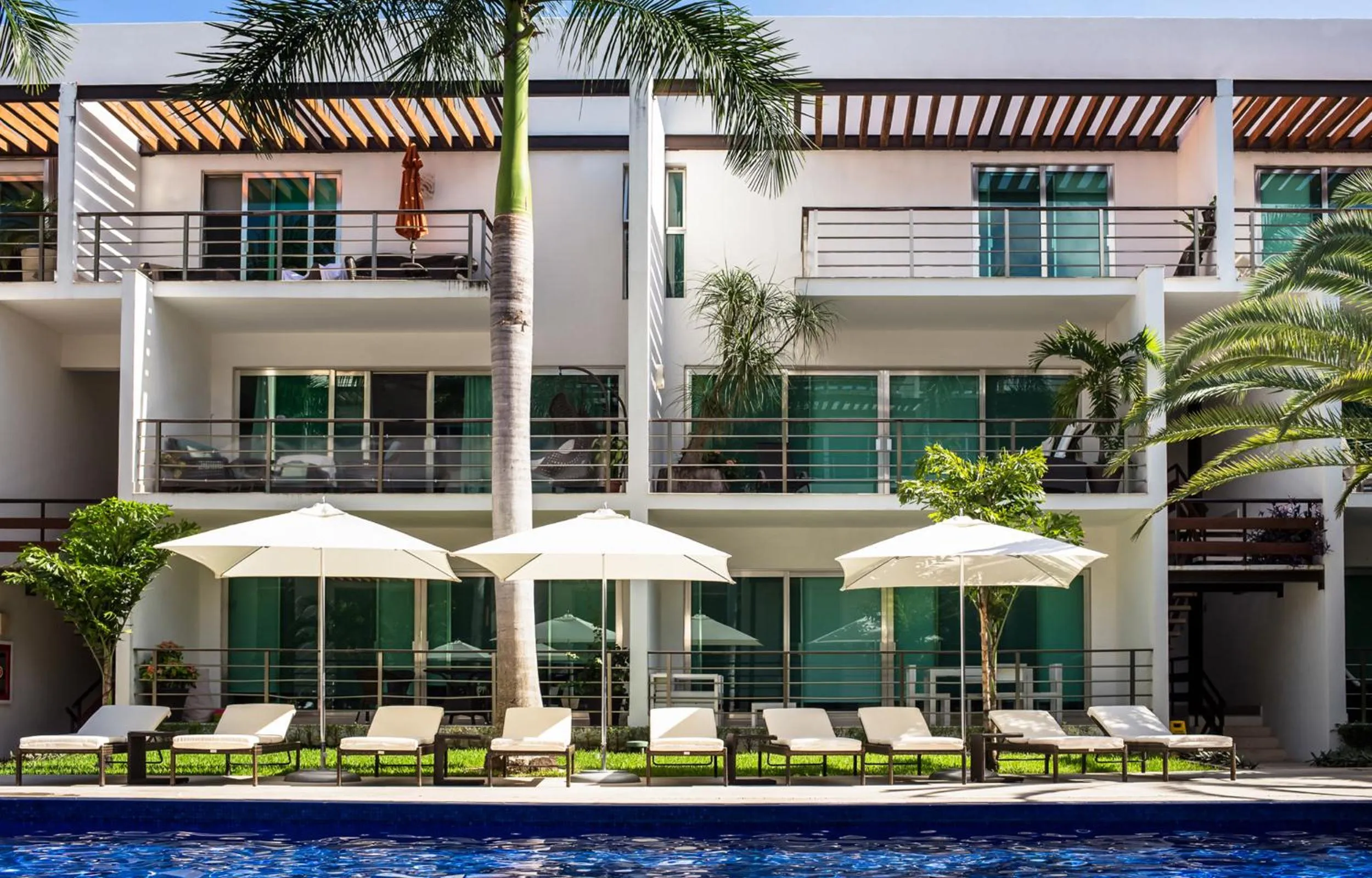 Swimming pool in Luxurious & Central Condo In Playa Steps From The Beach