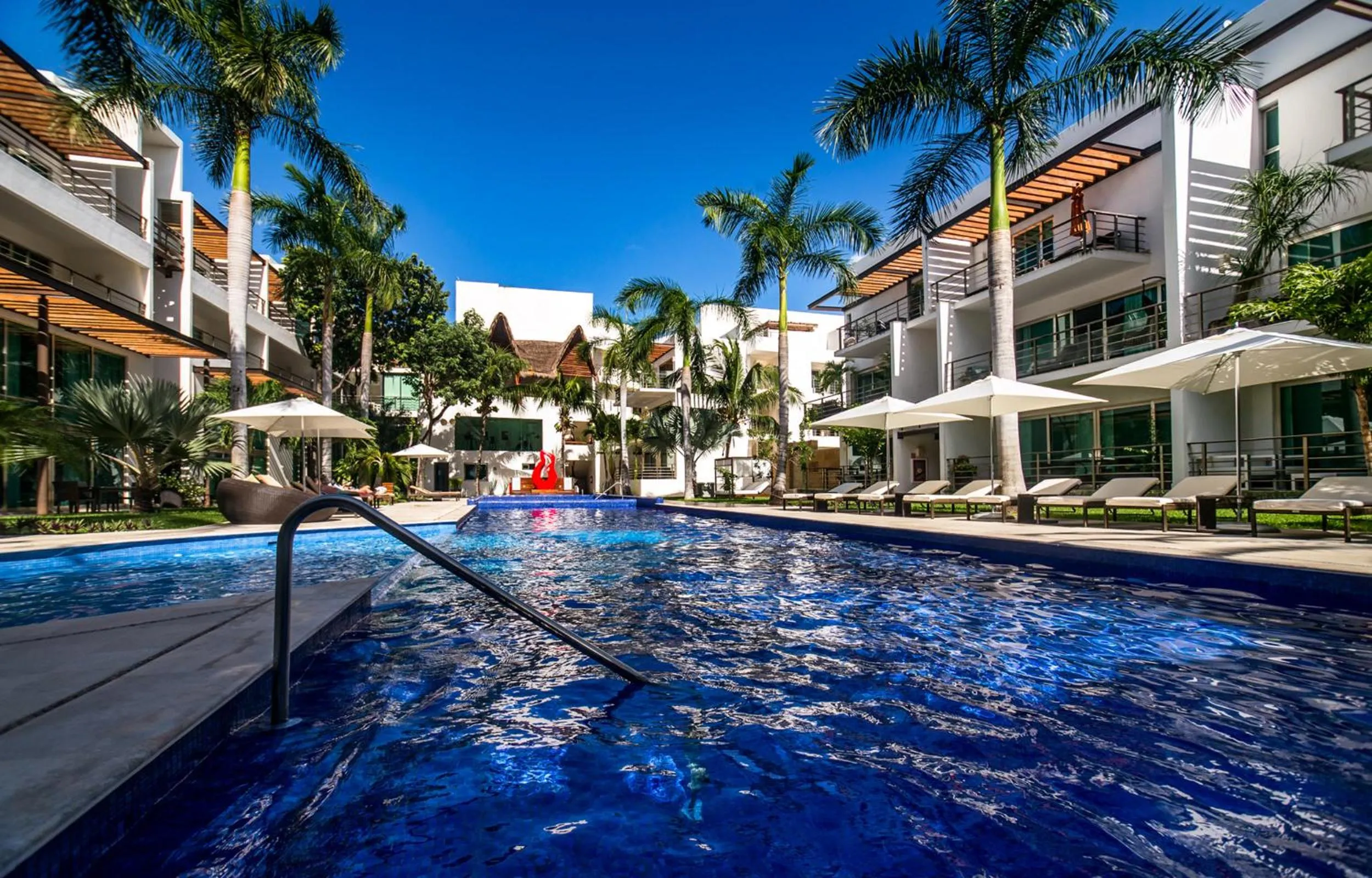 Swimming pool in Luxurious & Central Condo In Playa Steps From The Beach