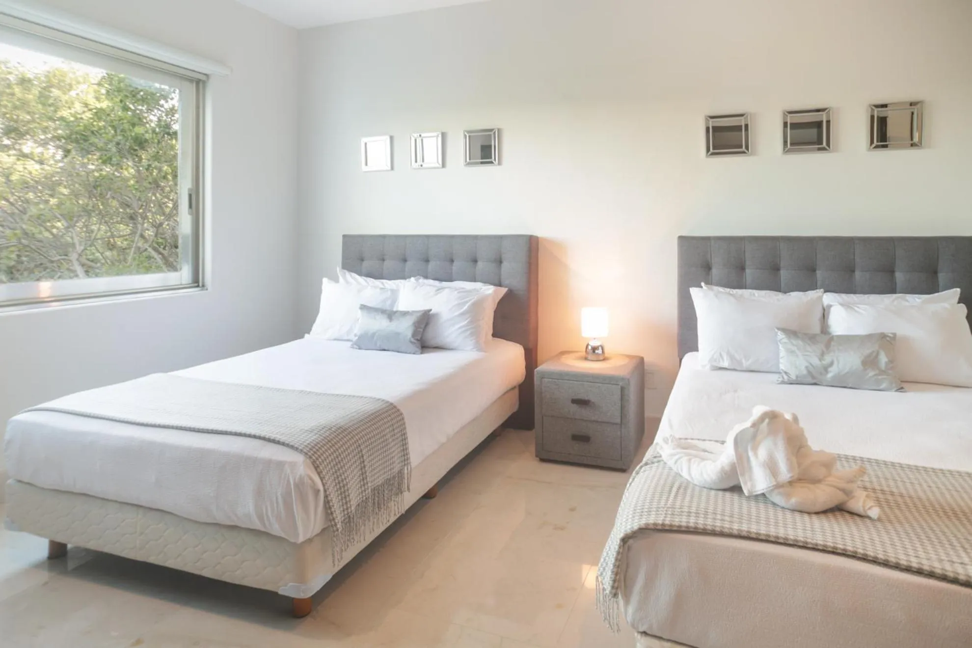 Bed in Luxurious & Central Condo In Playa Steps From The Beach