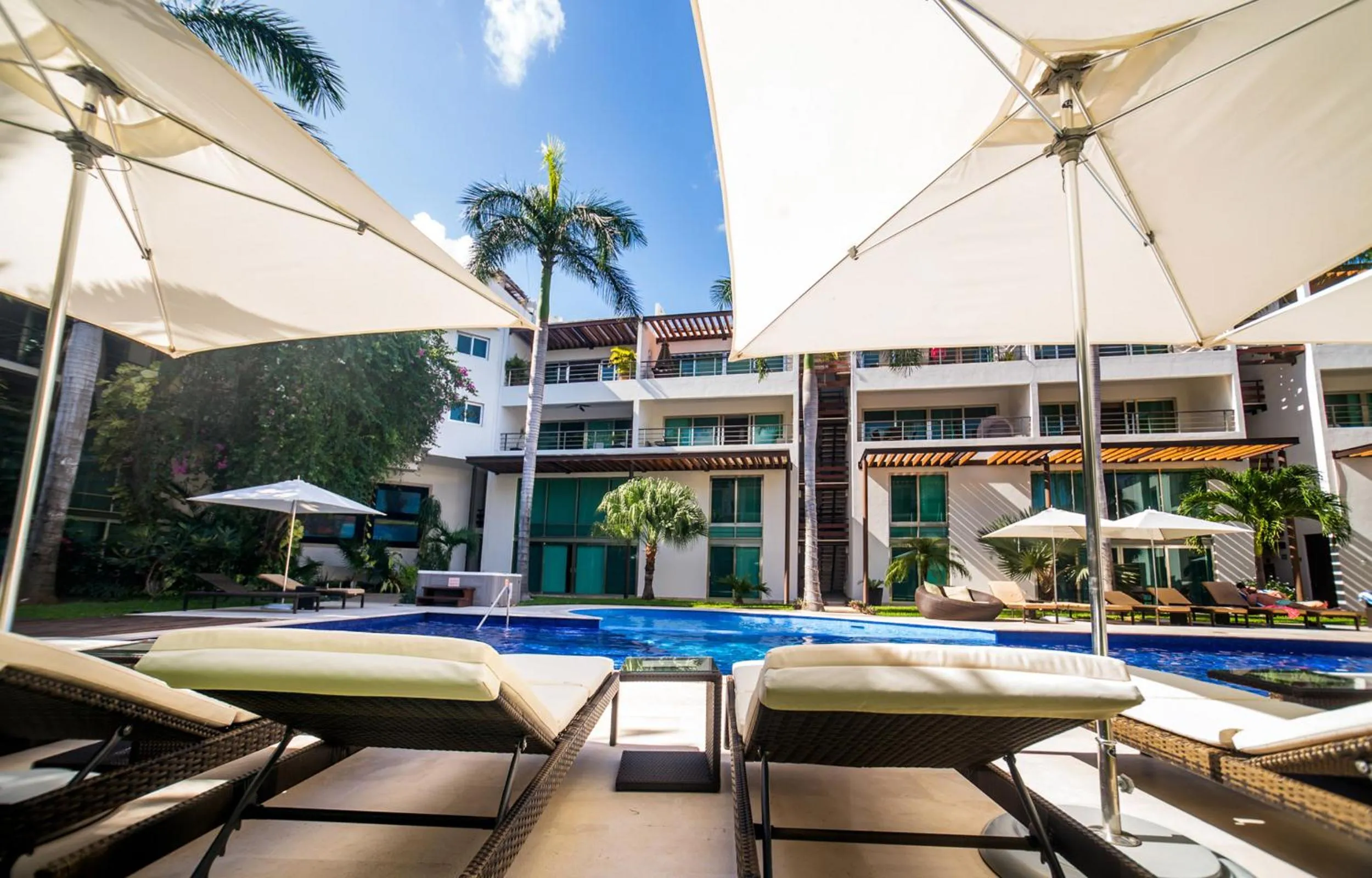 Swimming pool in Luxurious & Central Condo In Playa Steps From The Beach