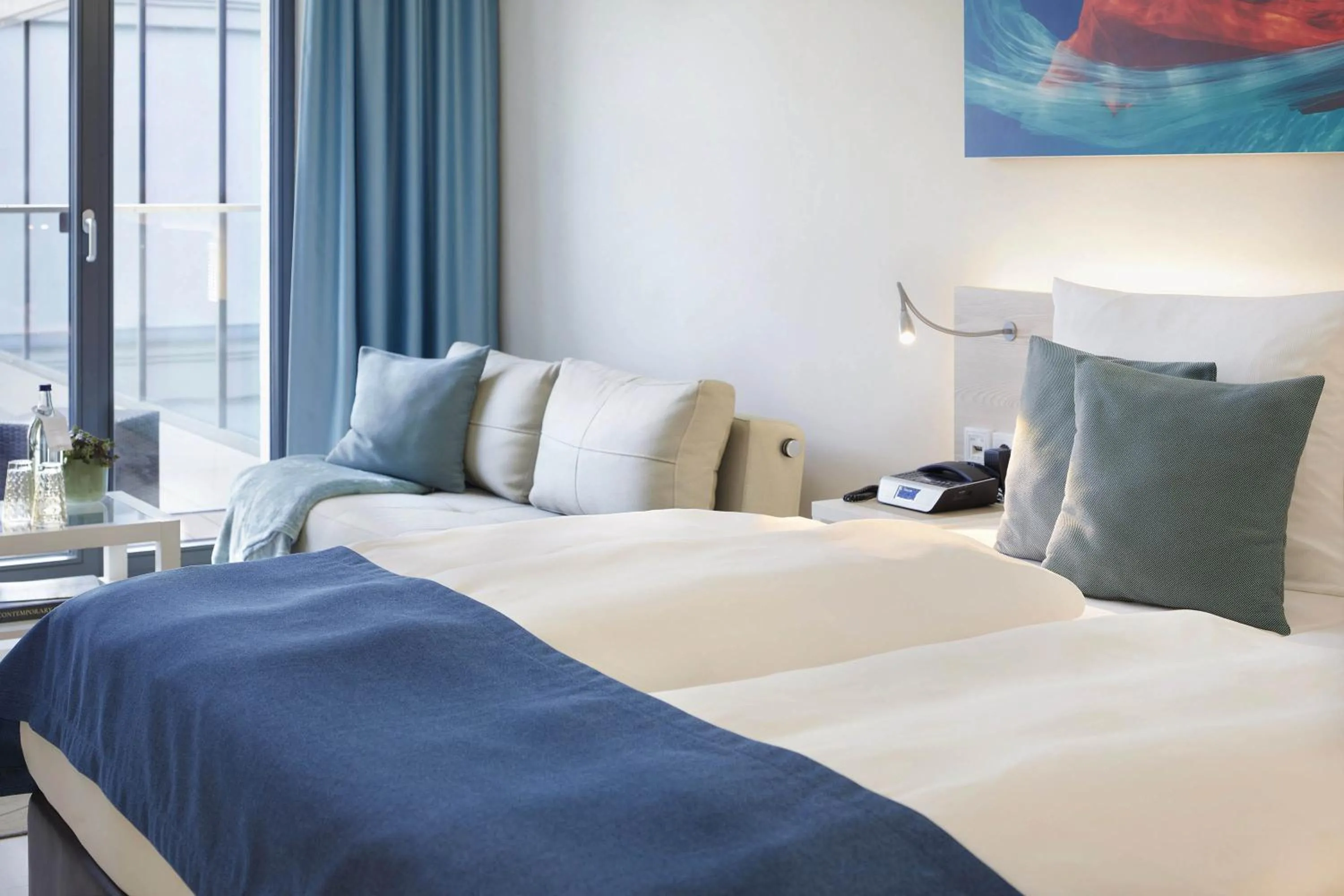 Photo of the whole room, Bed in SEETELHOTEL Kaiserstrand Beachhotel das Lifestyle-Hotel direkt am Strand