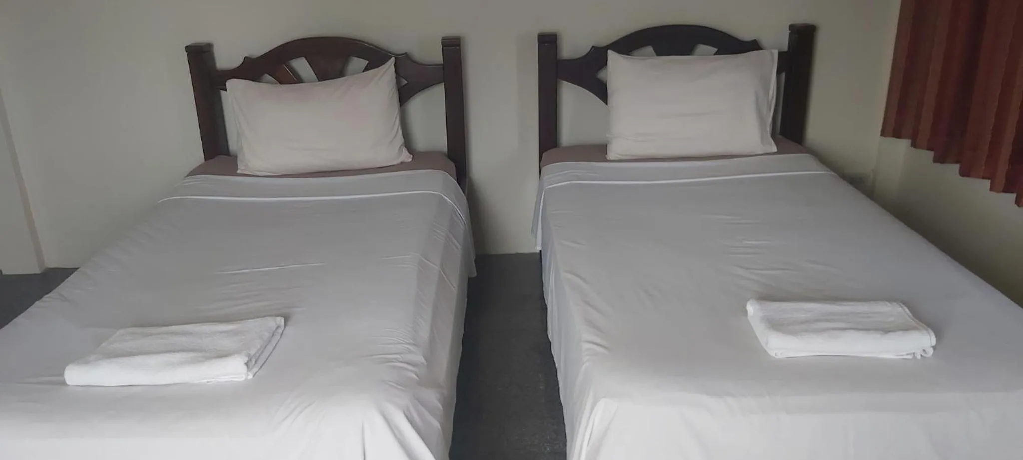 Bed in Relax Inn