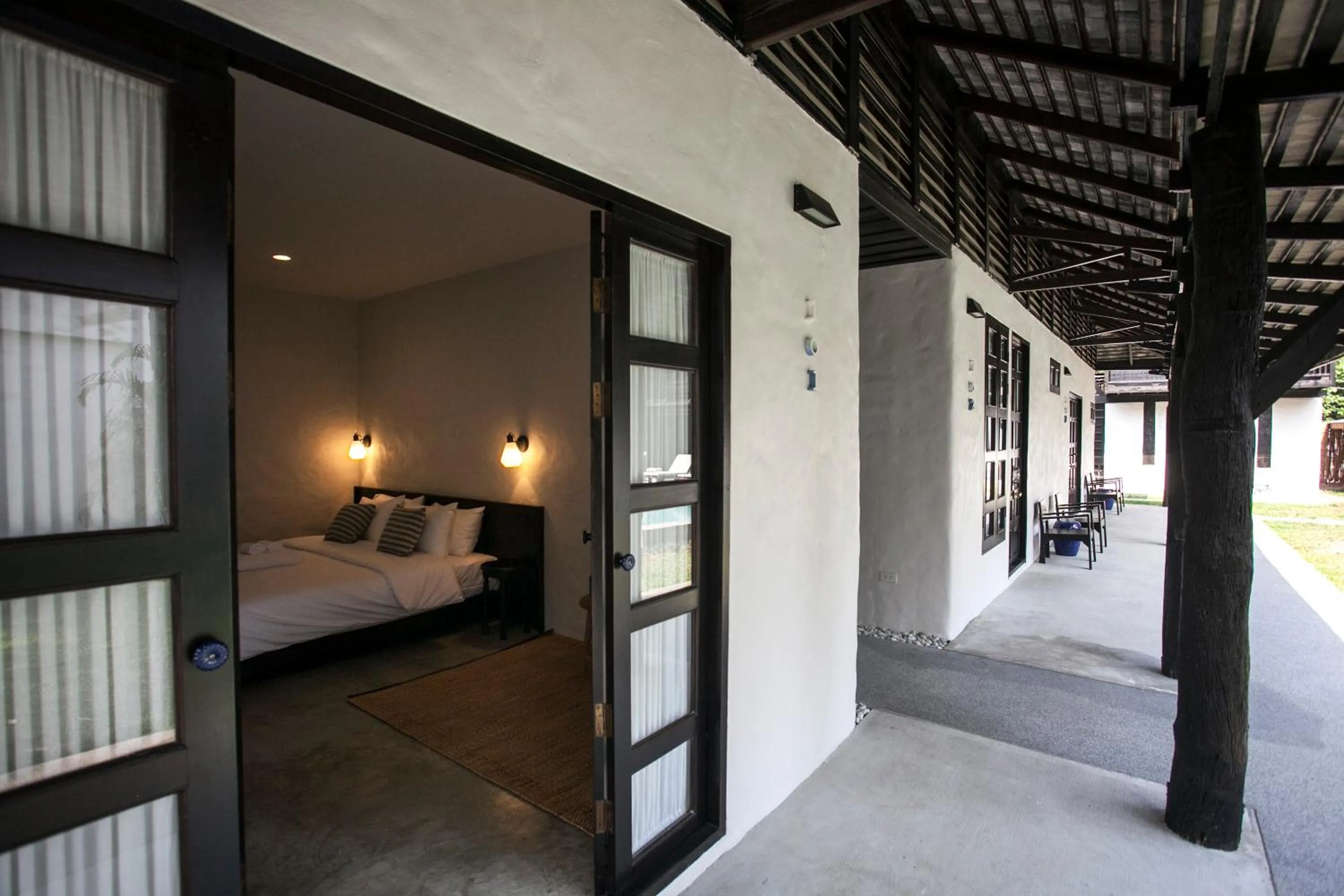 Bed in Chotana Villa Hotel Chiang Mai