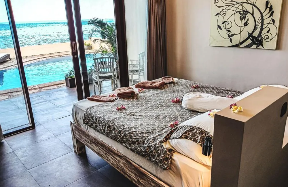 Bed in Relax Bali Dive & SPA ocean front resort