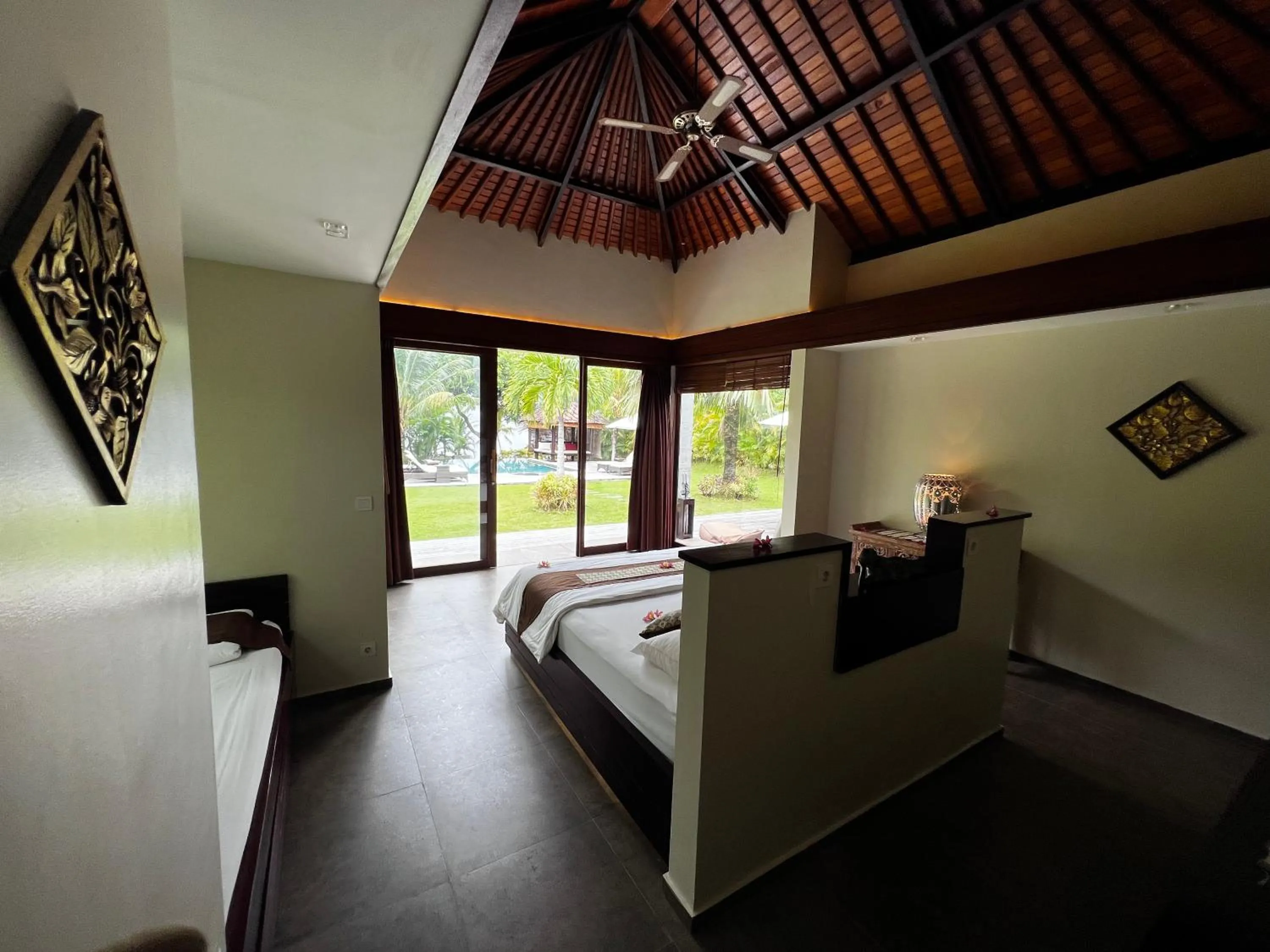 Bed in Relax Bali Dive & SPA ocean front resort