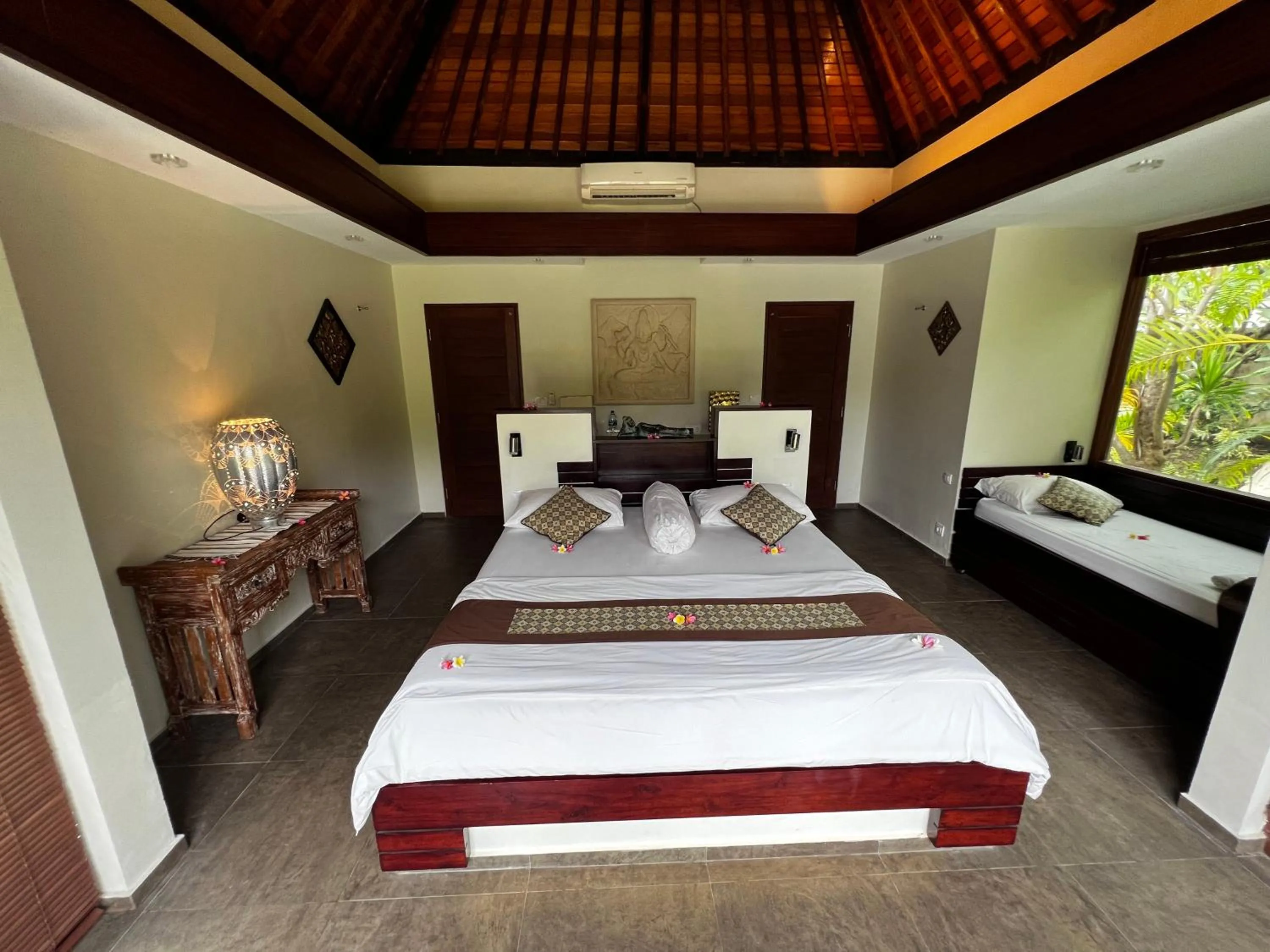 Bed in Relax Bali Dive & SPA ocean front resort