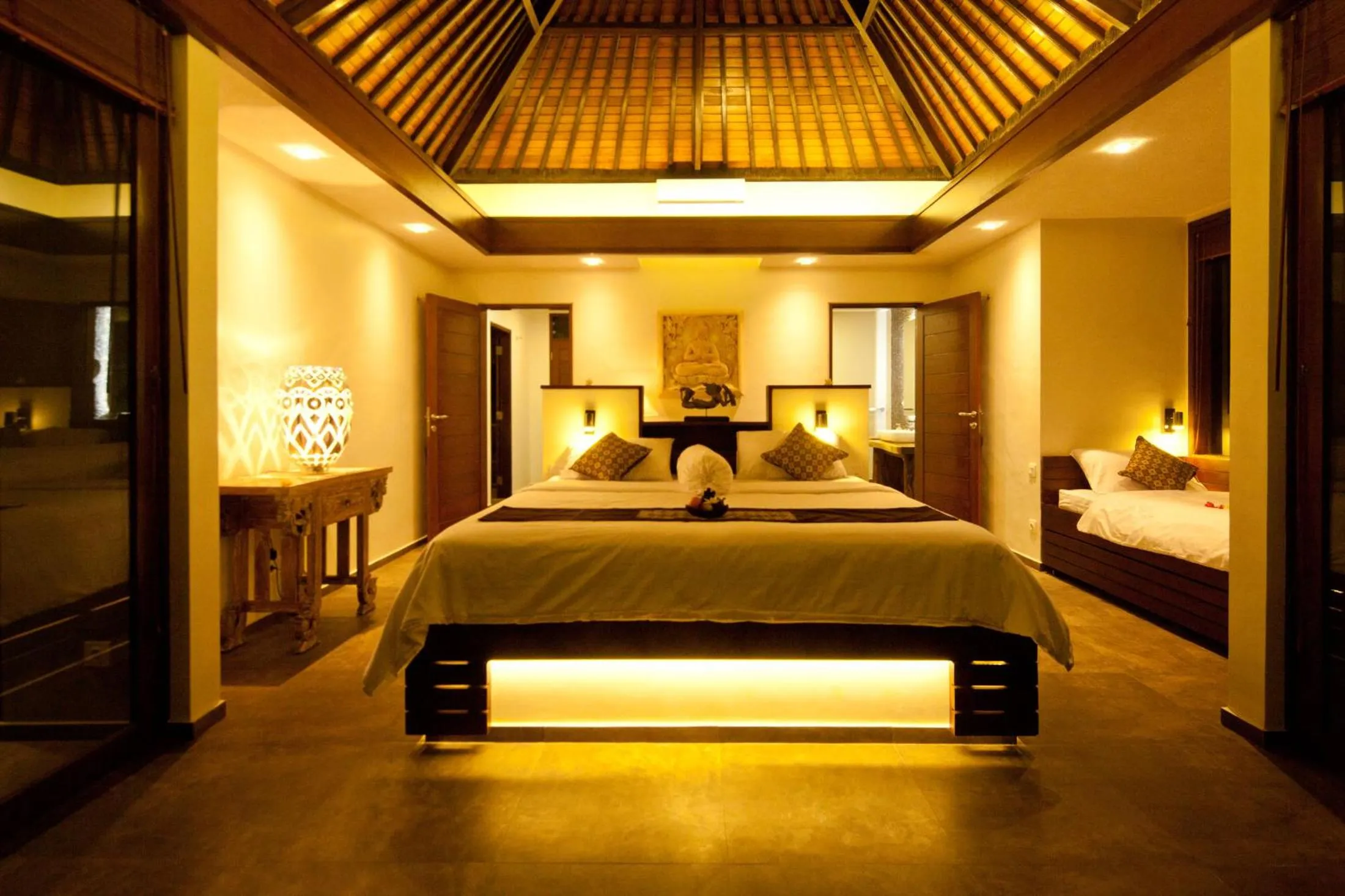 Bed in Relax Bali Dive & SPA ocean front resort