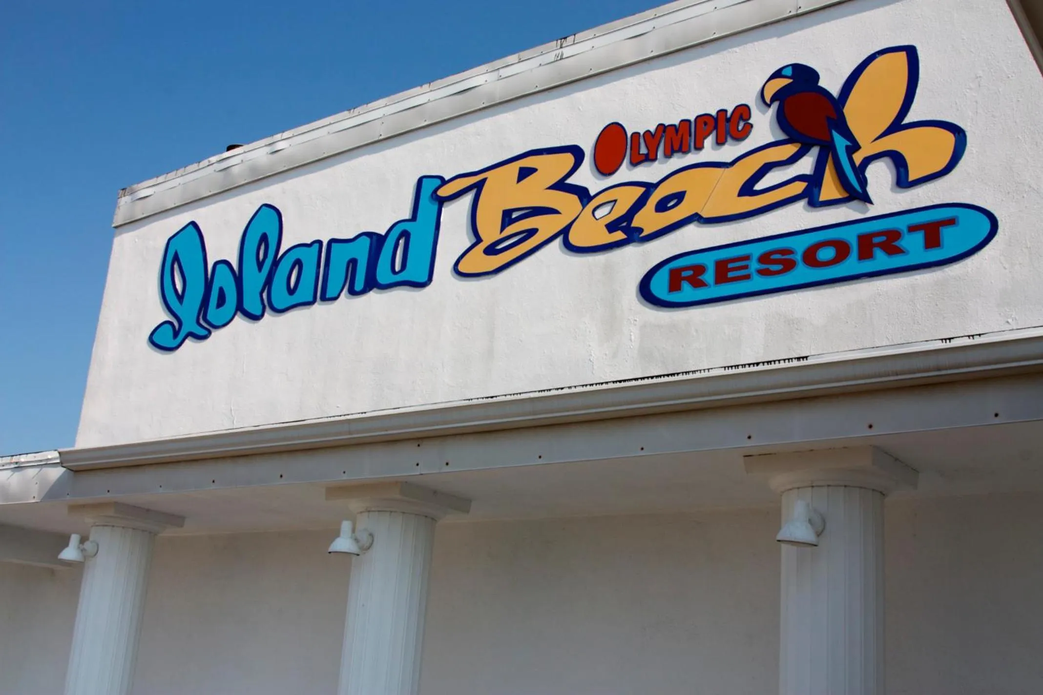 Property logo or sign in Olympic Island Beach Resort