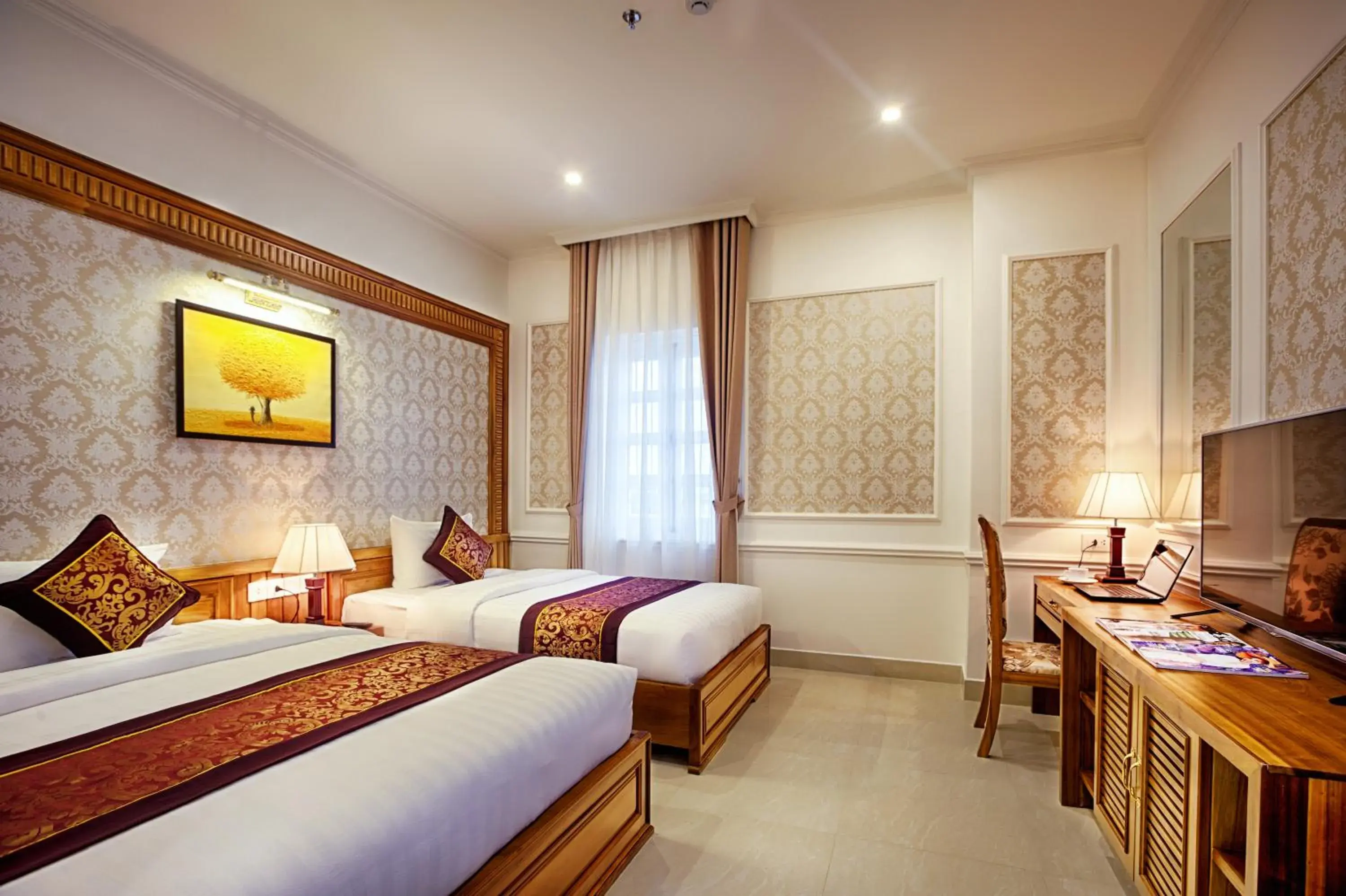 Deluxe Triple Room in Riverside Hotel Quang Binh Deluxe Triple Room in Riverside Hotel Quang Binh
