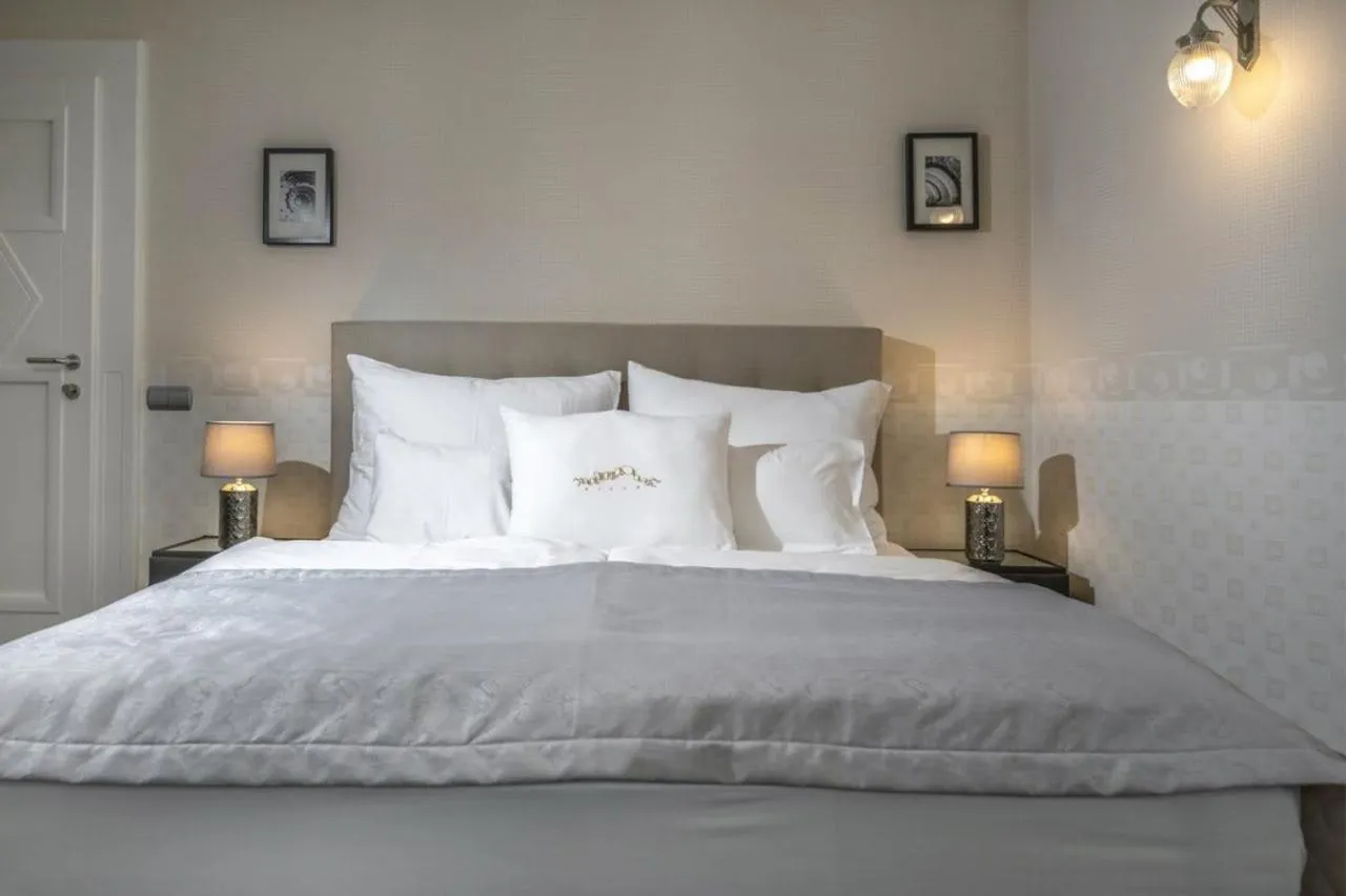 Bed in Erla Villa Boutique Hotel