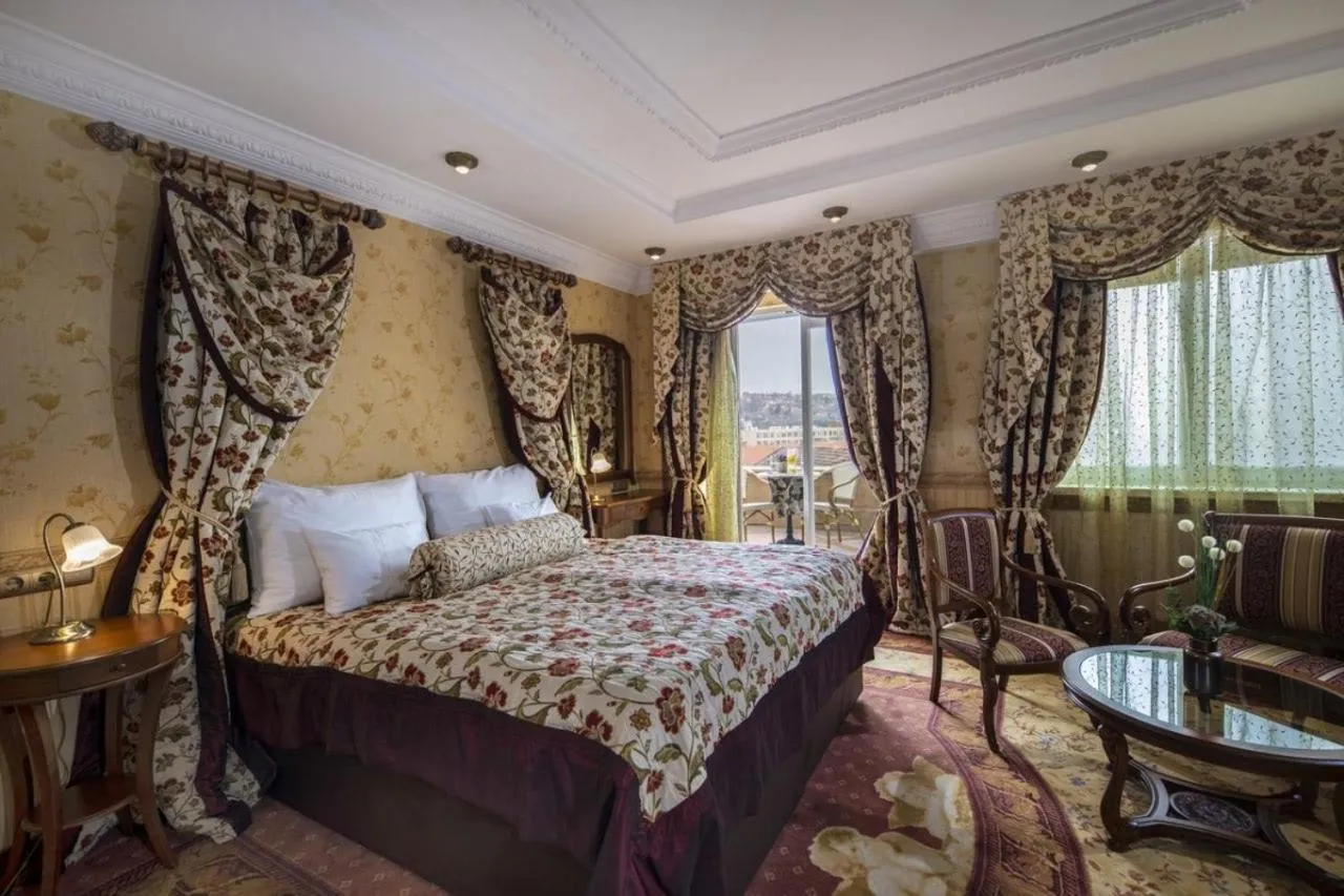 Bed in Erla Villa Boutique Hotel