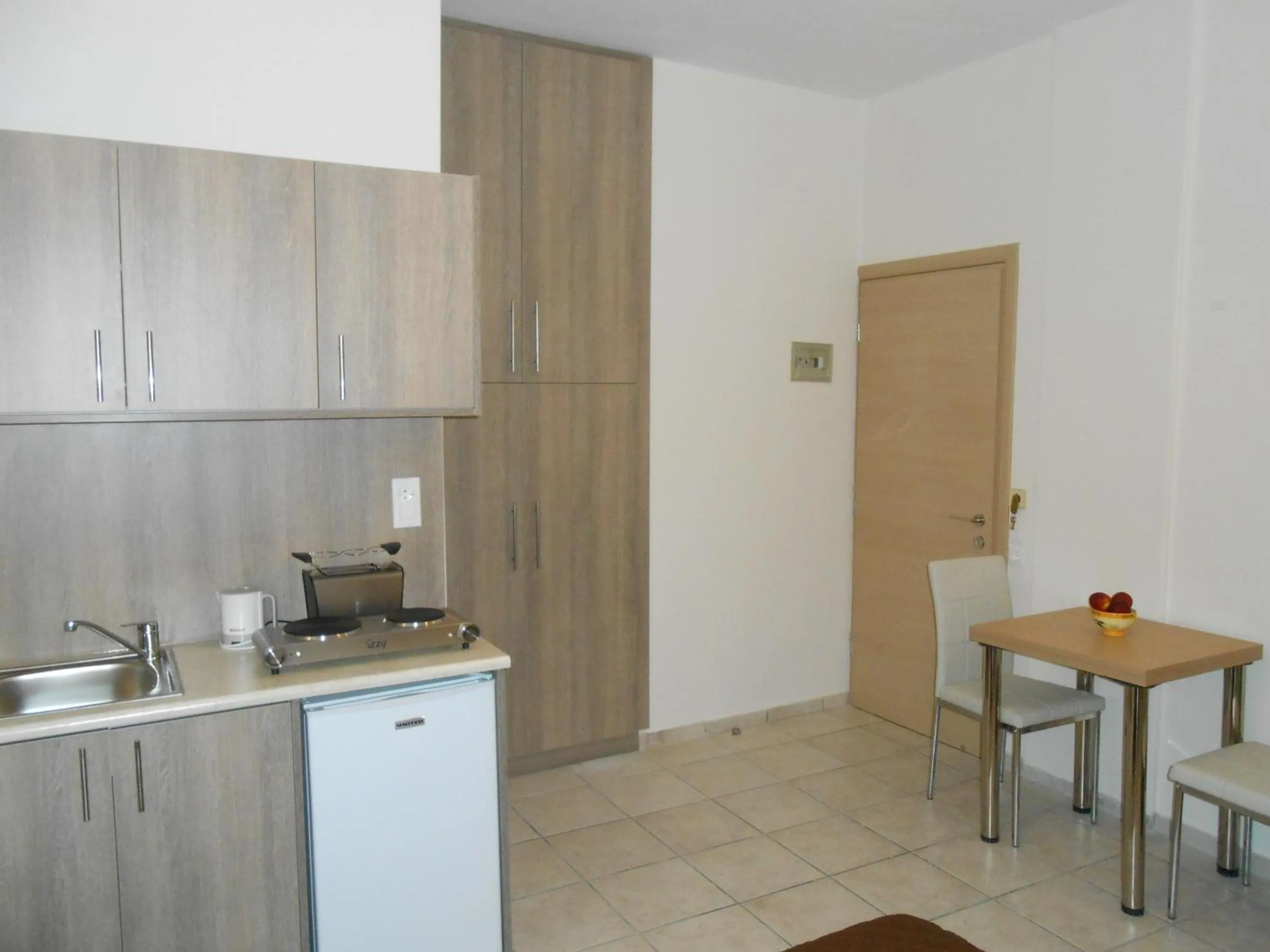Kitchen or kitchenette in Voula Hotel