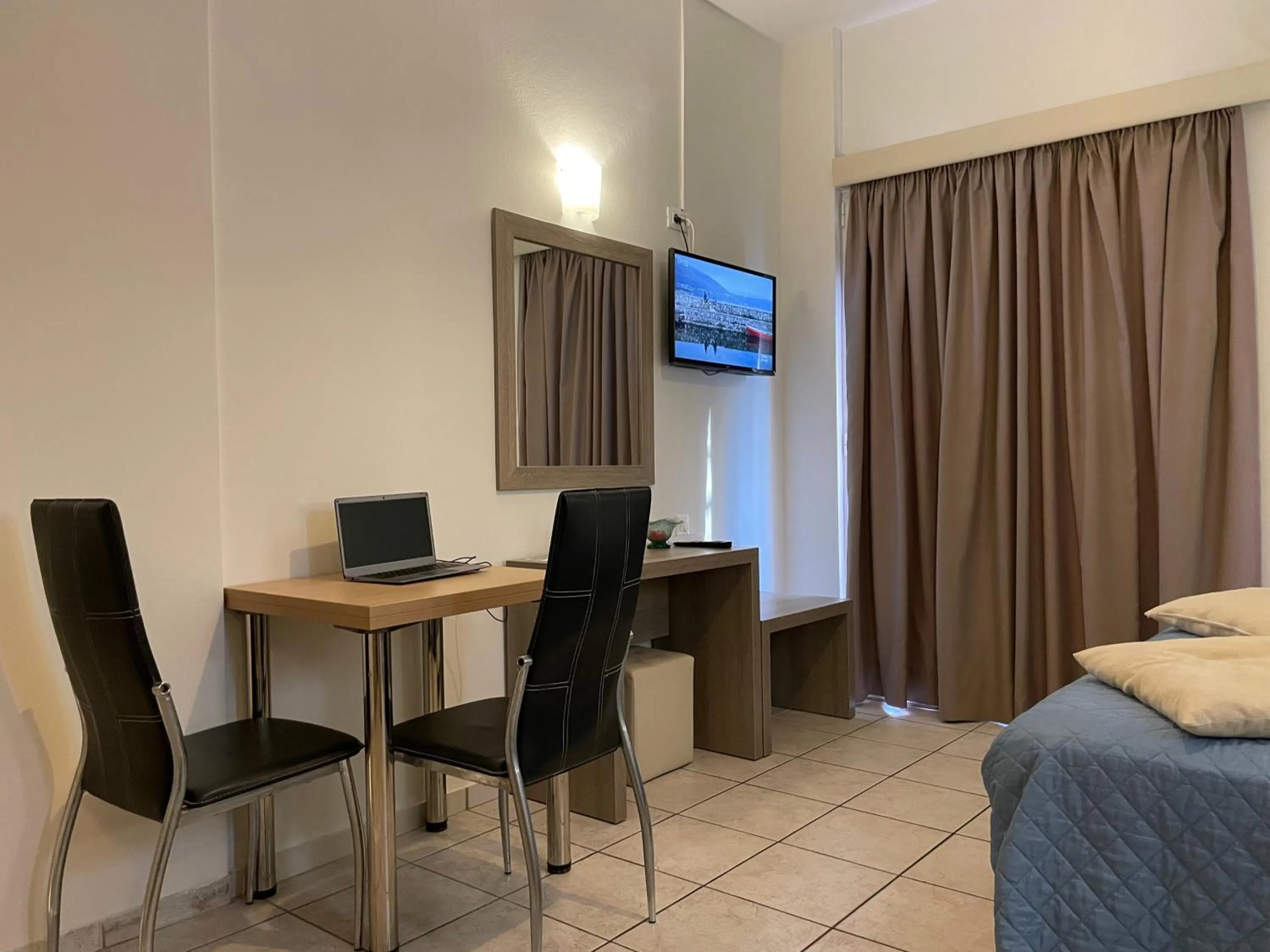 Living room, Bed in Voula Hotel