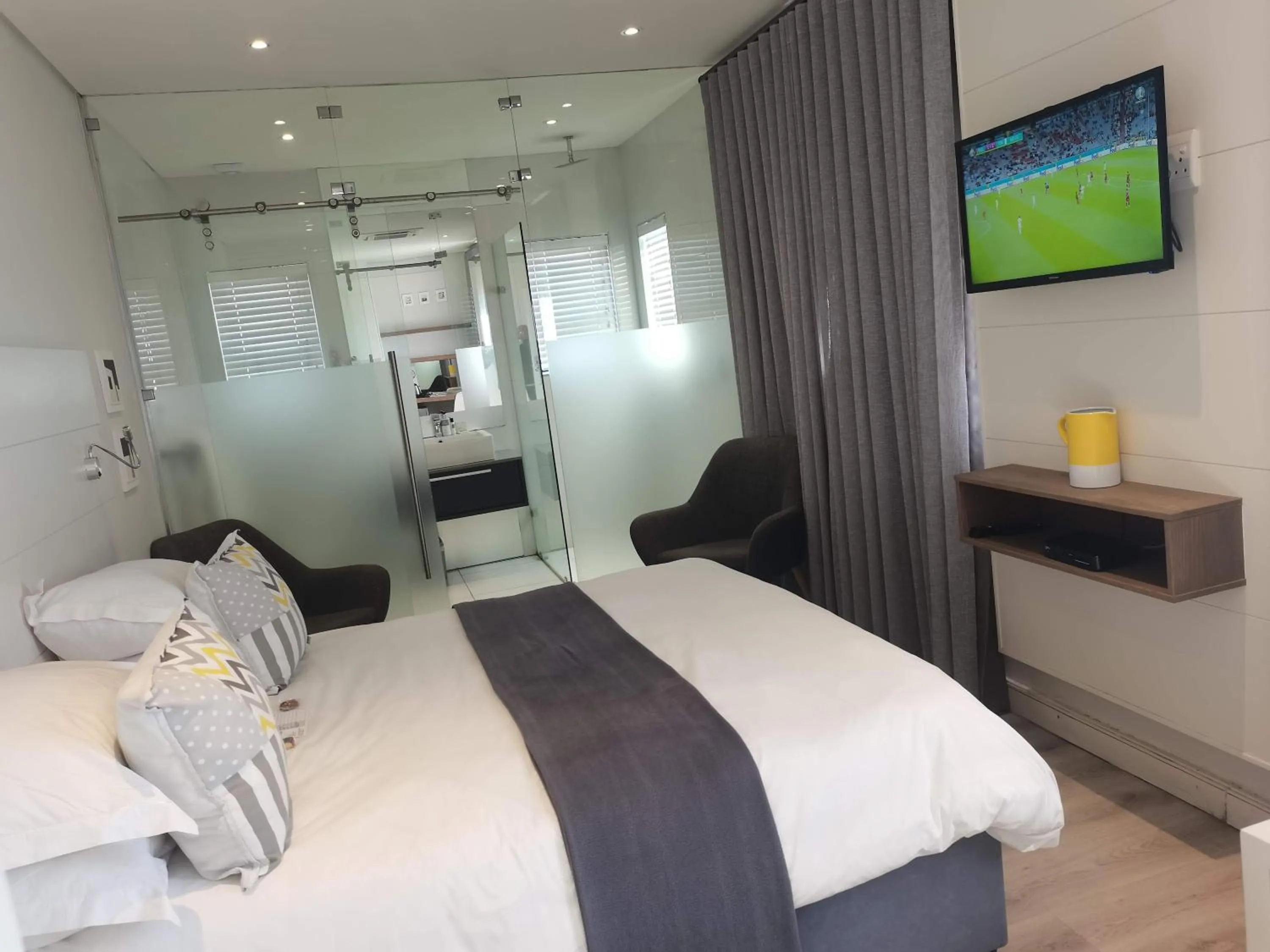 Bed in The Paralian Exclusive Guest House