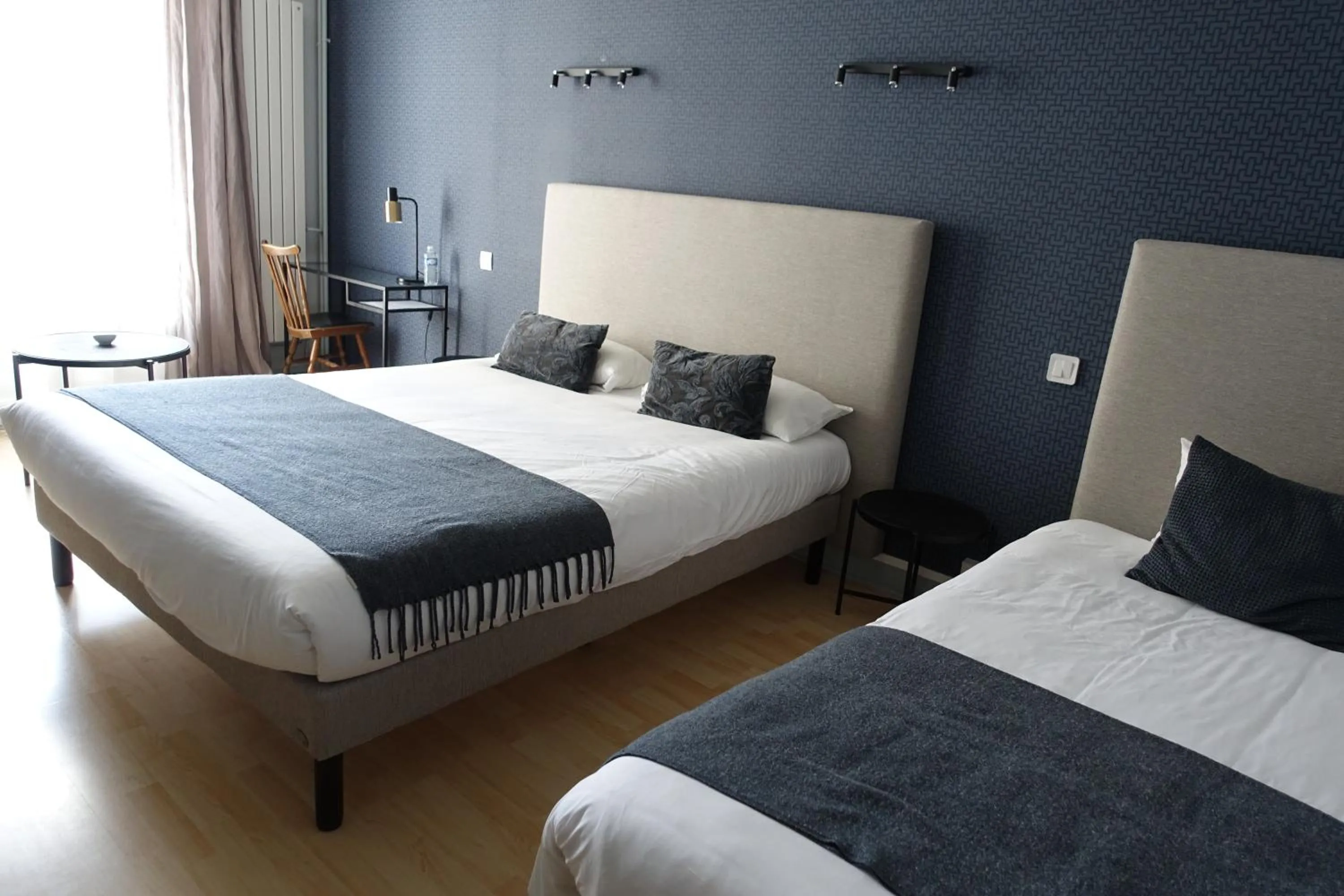 Bed in Logis Hôtel Emeraude