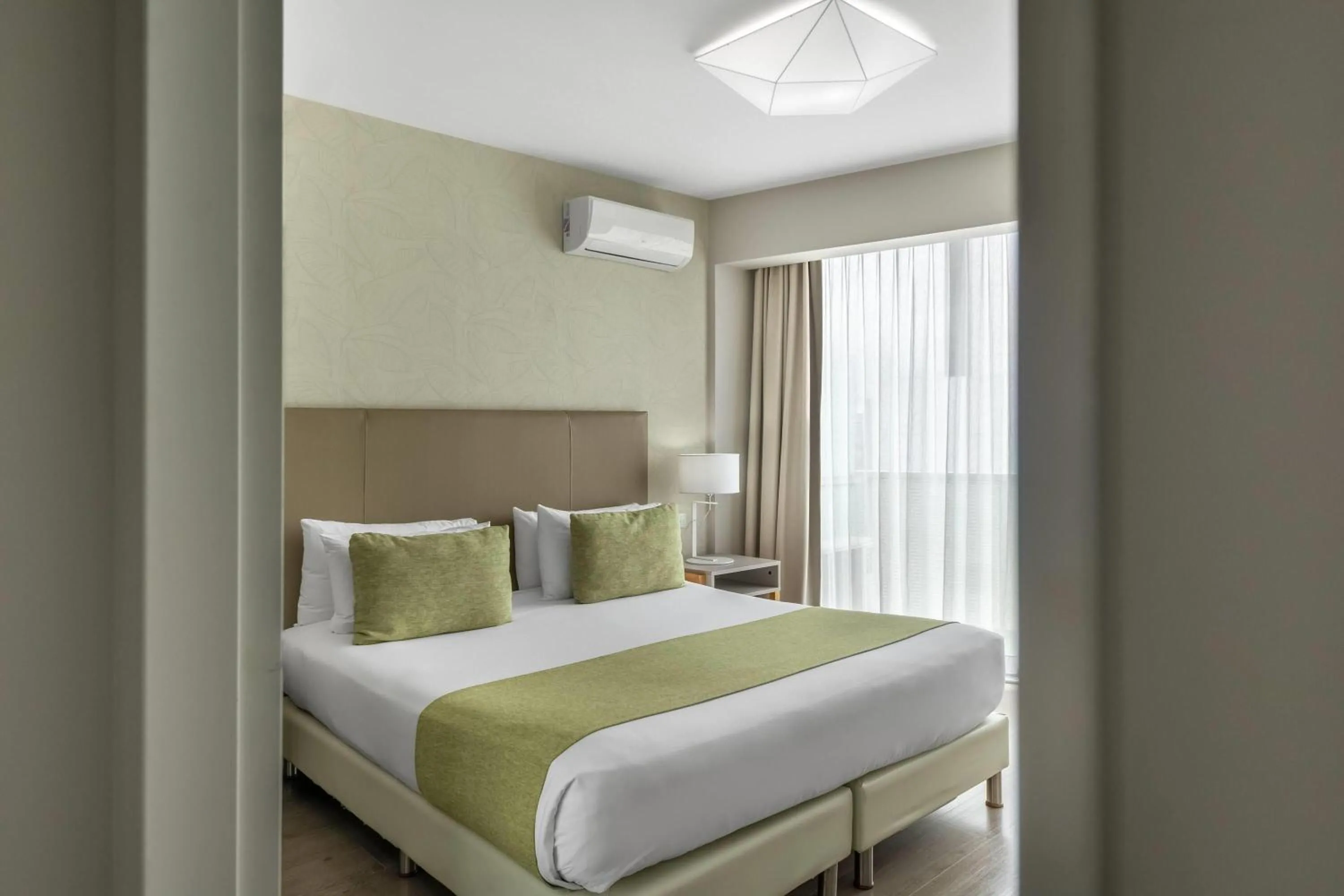 Photo of the whole room, Bed in Dazzler by Wyndham Polo