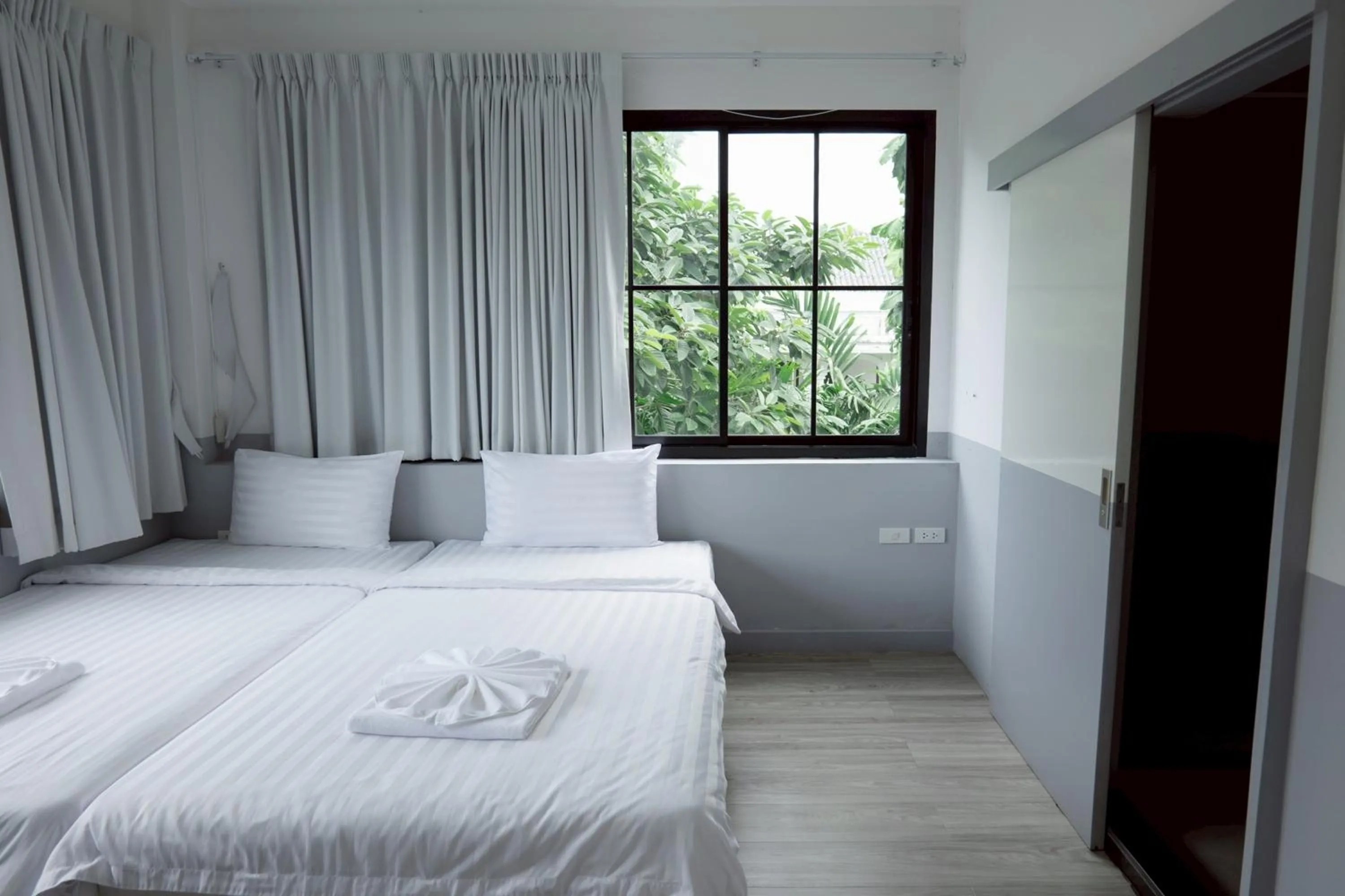 Photo of the whole room, Bed in Surachet at 257 Boutique House