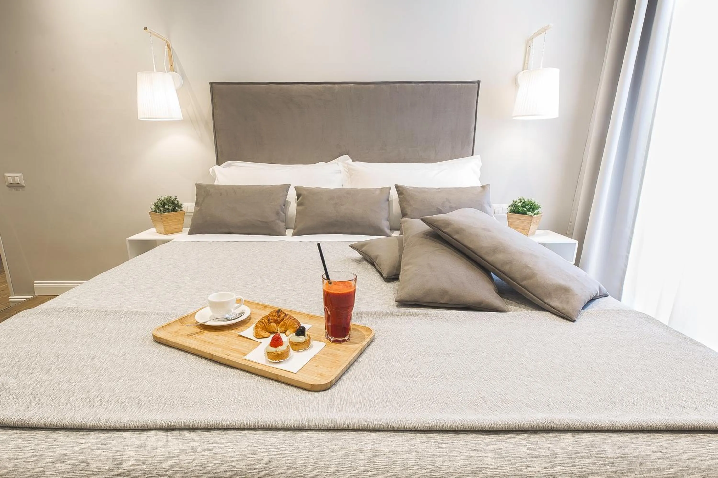 Bed in Colonna Luxury Suites