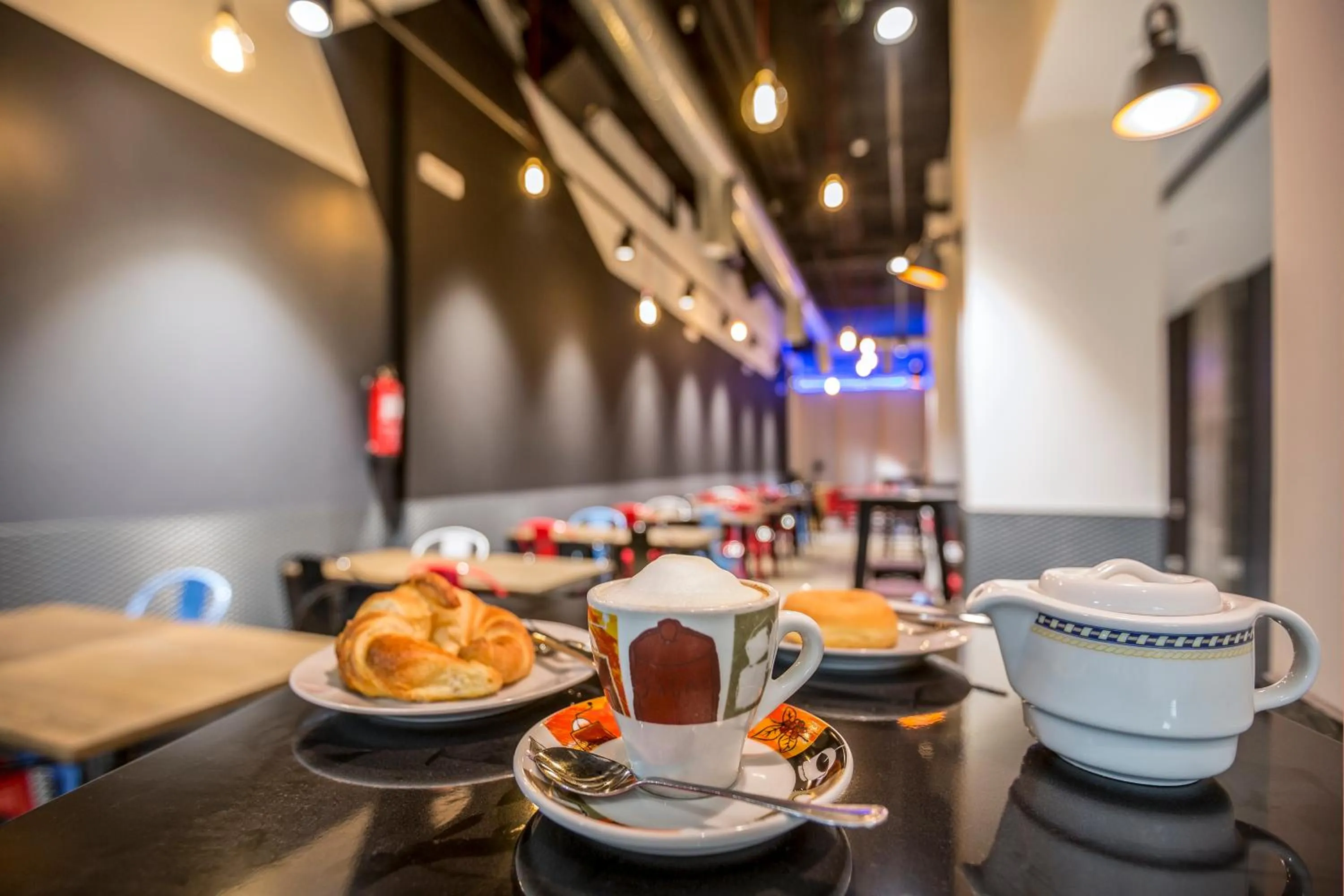 Communal lounge/ TV room in Mola Hostel