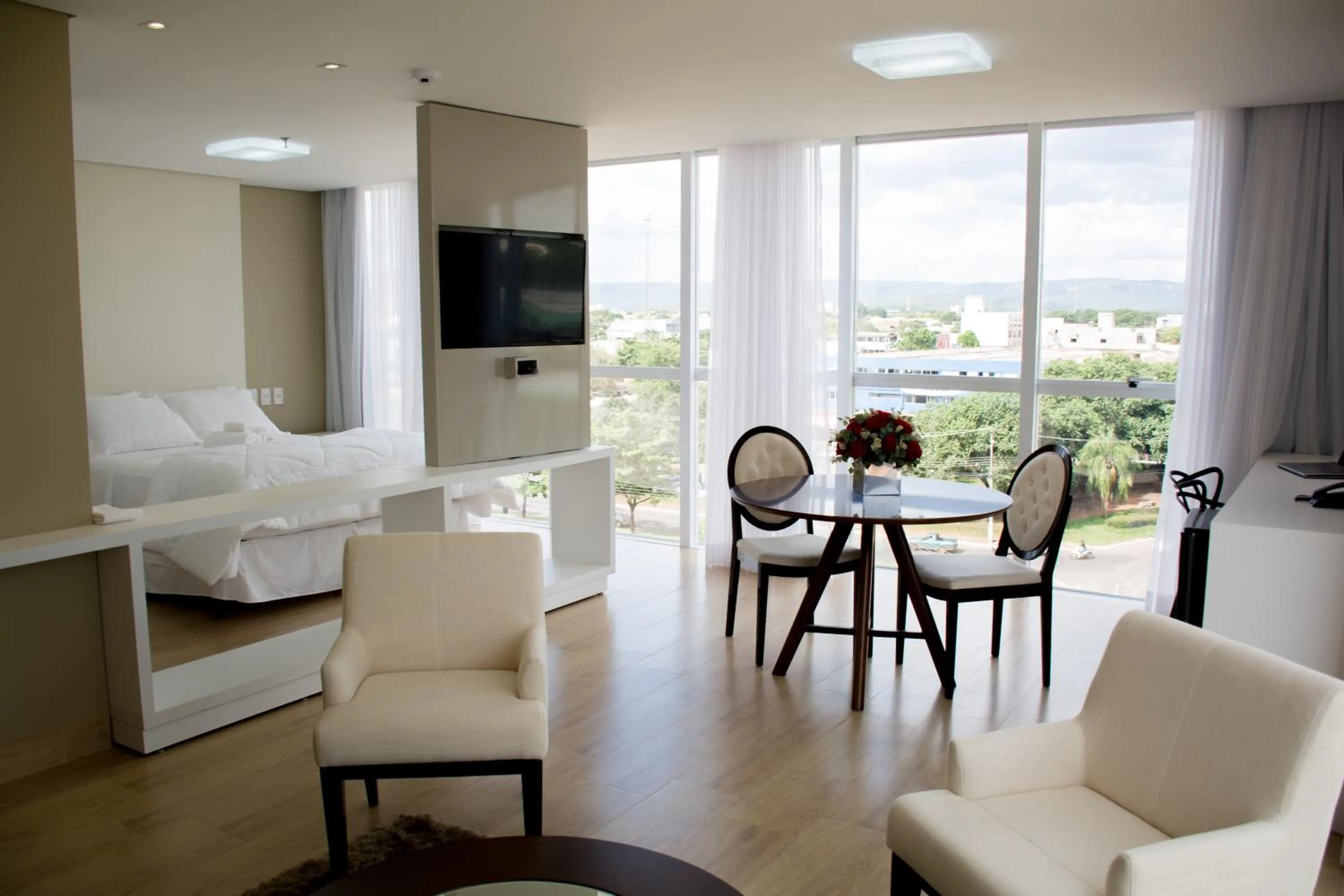 Living room, Bed in Select Hotel