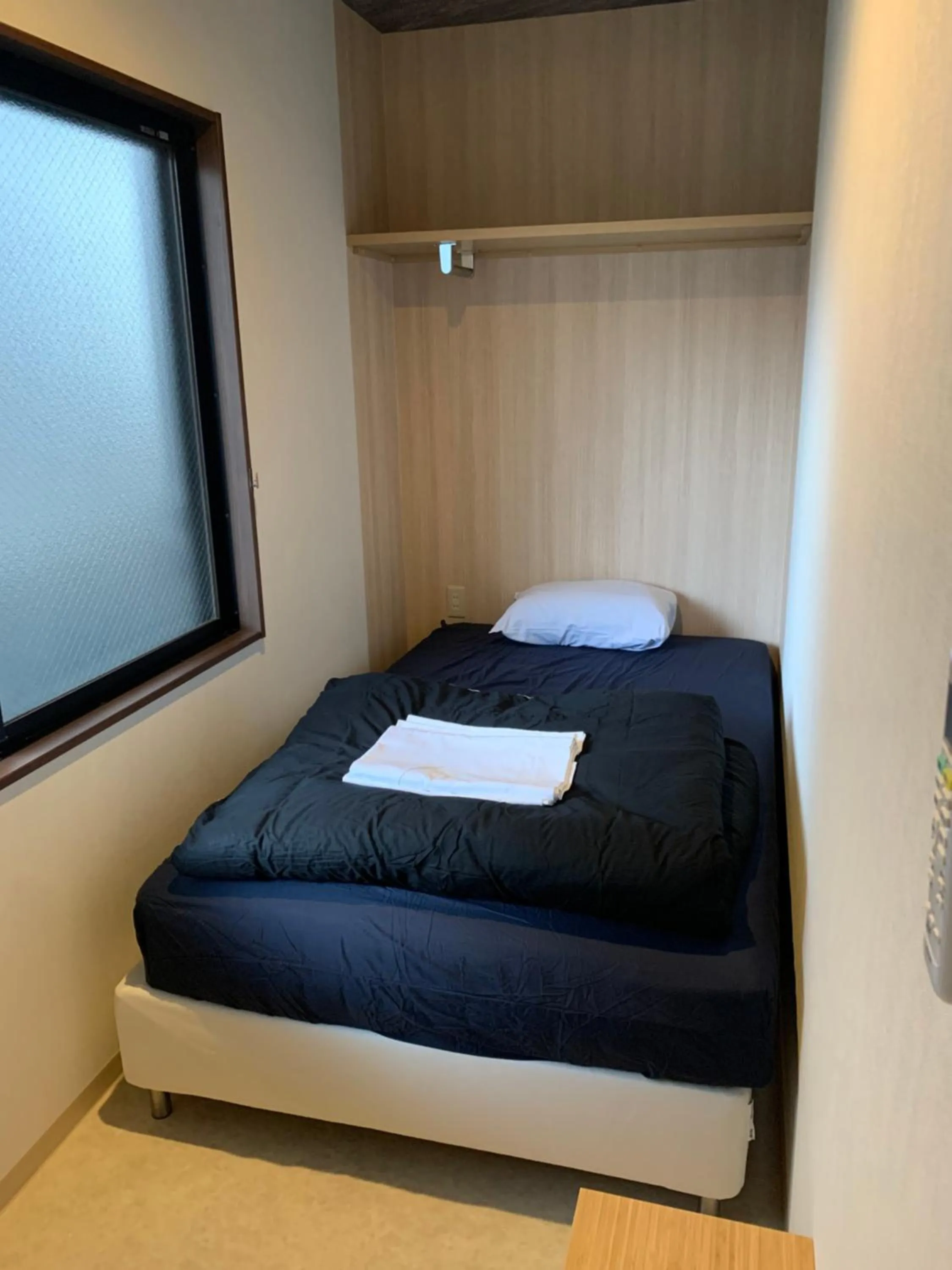 Bed in BEPPU ROJIURA stay&sauna