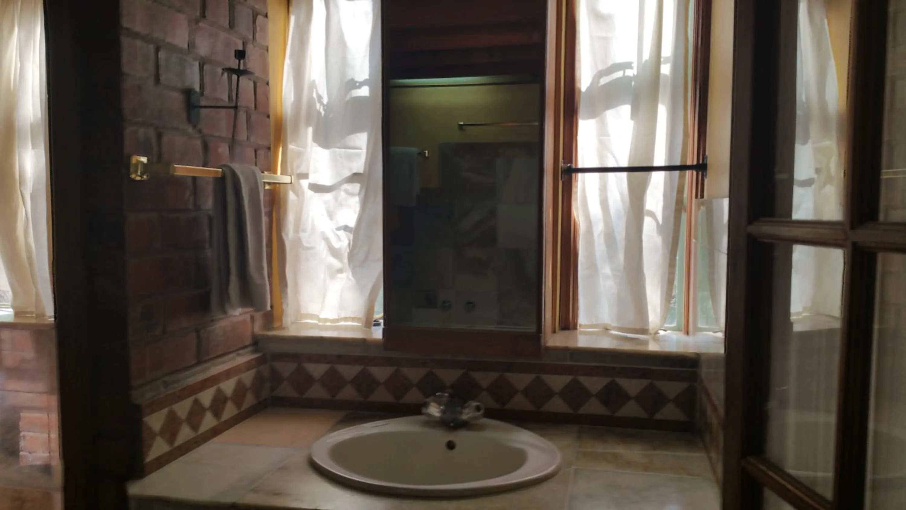 Bathroom in Woodmere Grand Hotel & Serviced Apartments