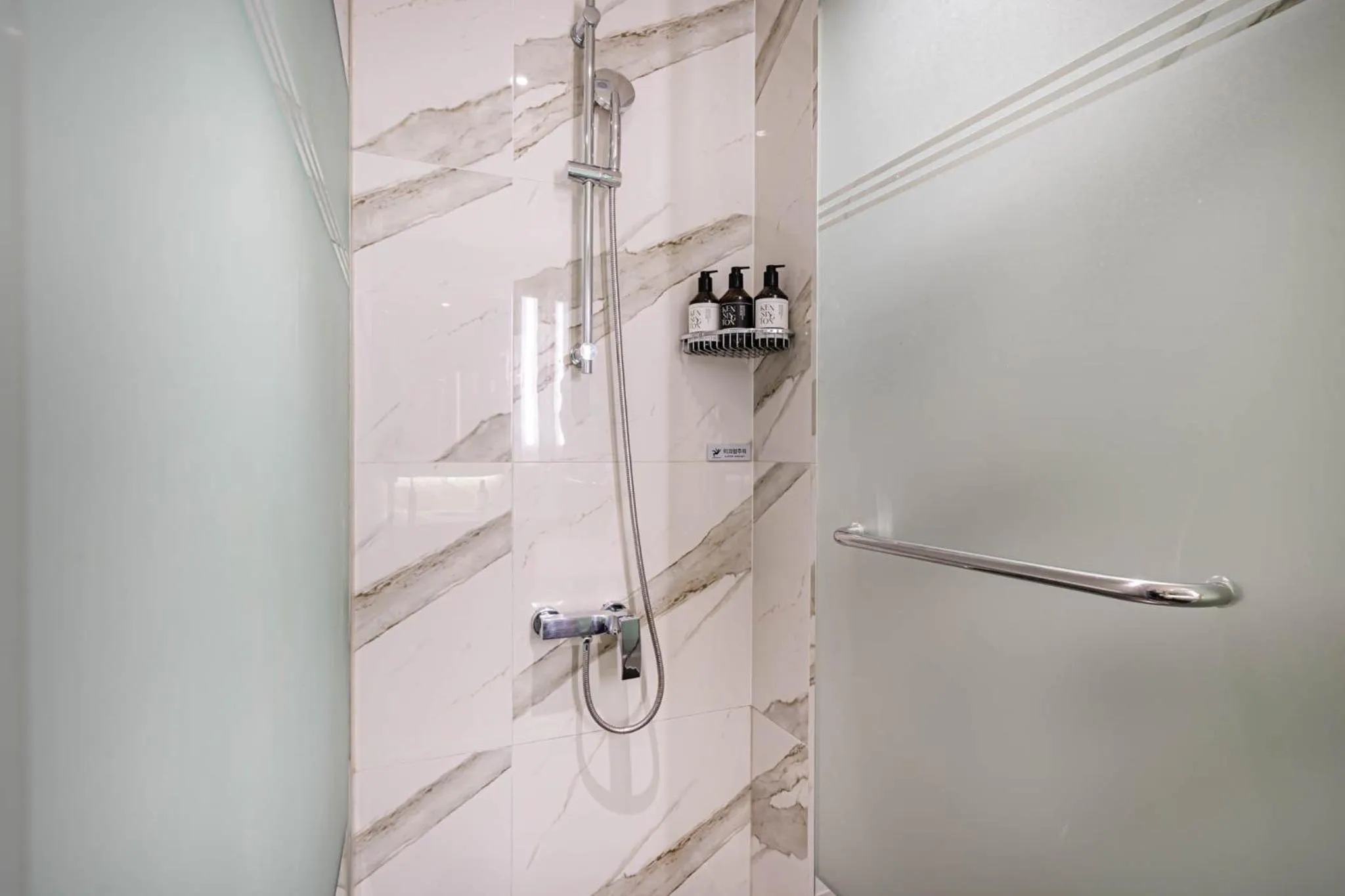 Shower in Kent Hotel Gwangalli by Kensington